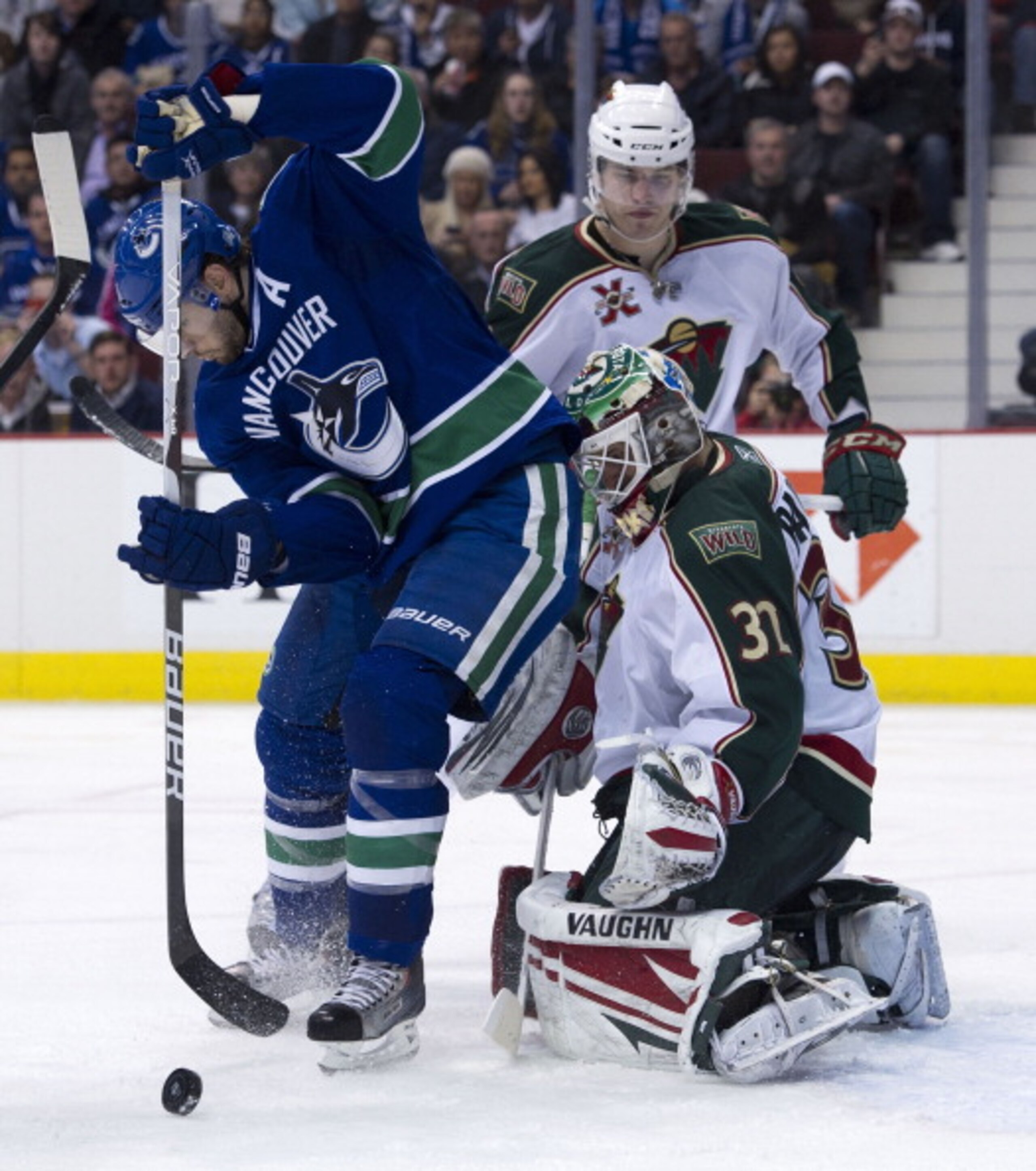 VANCOUVER, CANADA - APRIL 7: Ryan Kesler #17 of the Vancouver Canucks tries to redirect the puck past goalie Niklas Backstrom #32 of the Minnesota Wild during the second period in NHL action on April 07, 2011 at Rogers Arena in Vancouver, BC, Canada. (Ph VANCOUVER, CANADA - APRIL 7: Ryan Kesler #17 of the Vancouver Canucks tries to redirect the puck past goalie Niklas Backstrom #32 of the Minnesota Wild during the second period in NHL action on April 07, 2011 at Rogers Arena in Vancouver, BC, Canada. (Ph