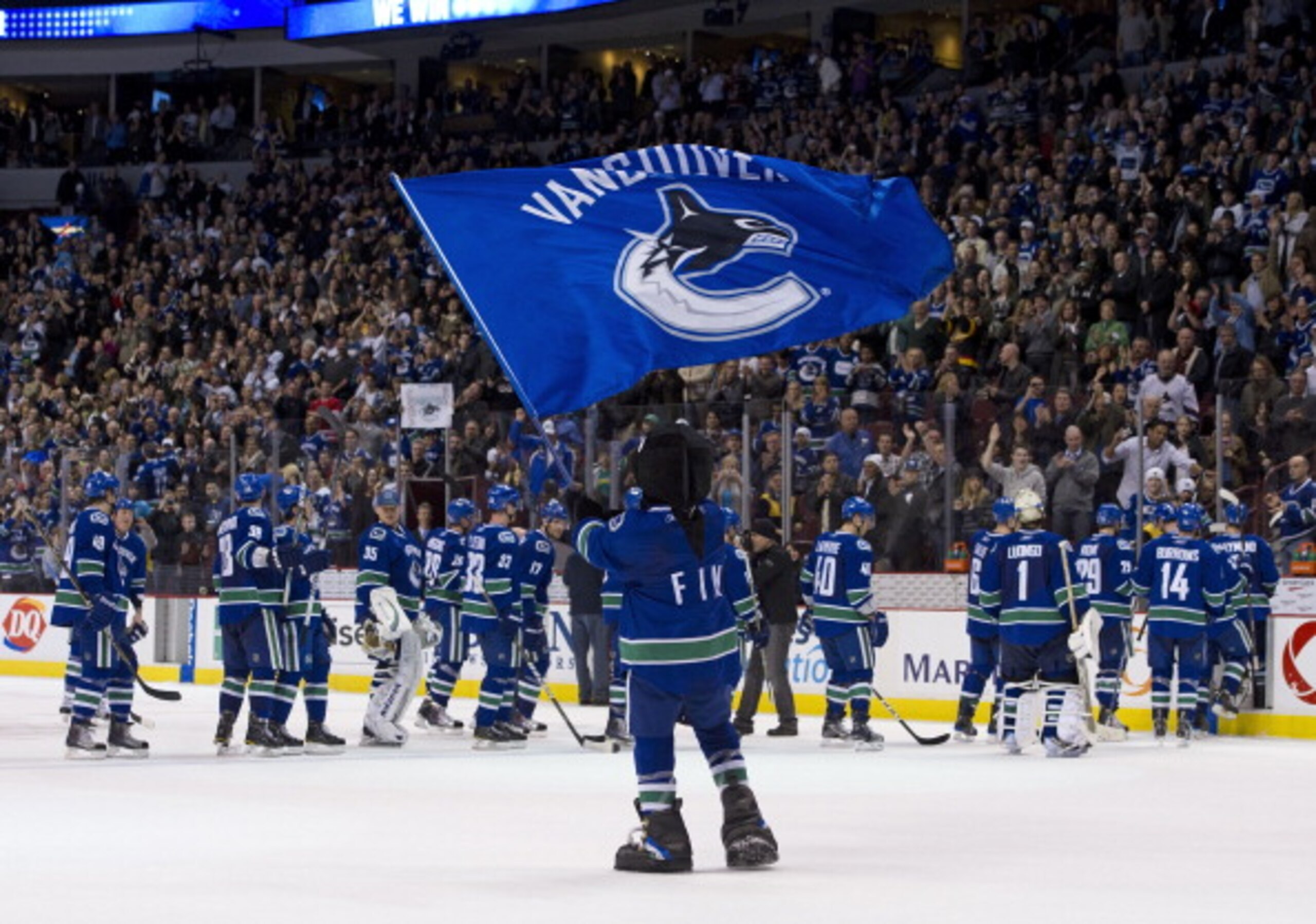VANCOUVER, CANADA - MARCH 31: Vancouver Canucks mascot Fin waves a team flag after the Vancouver Canucks defeated the Los Angeles Kings in NHL action on March 31, 2011 at Rogers Arena in Vancouver, BC, Canada. (Photo by Rich Lam/Getty Images) VANCOUVER, CANADA - MARCH 31: Vancouver Canucks mascot Fin waves a team flag after the Vancouver Canucks defeated the Los Angeles Kings in NHL action on March 31, 2011 at Rogers Arena in Vancouver, BC, Canada. (Photo by Rich Lam/Getty Images)
