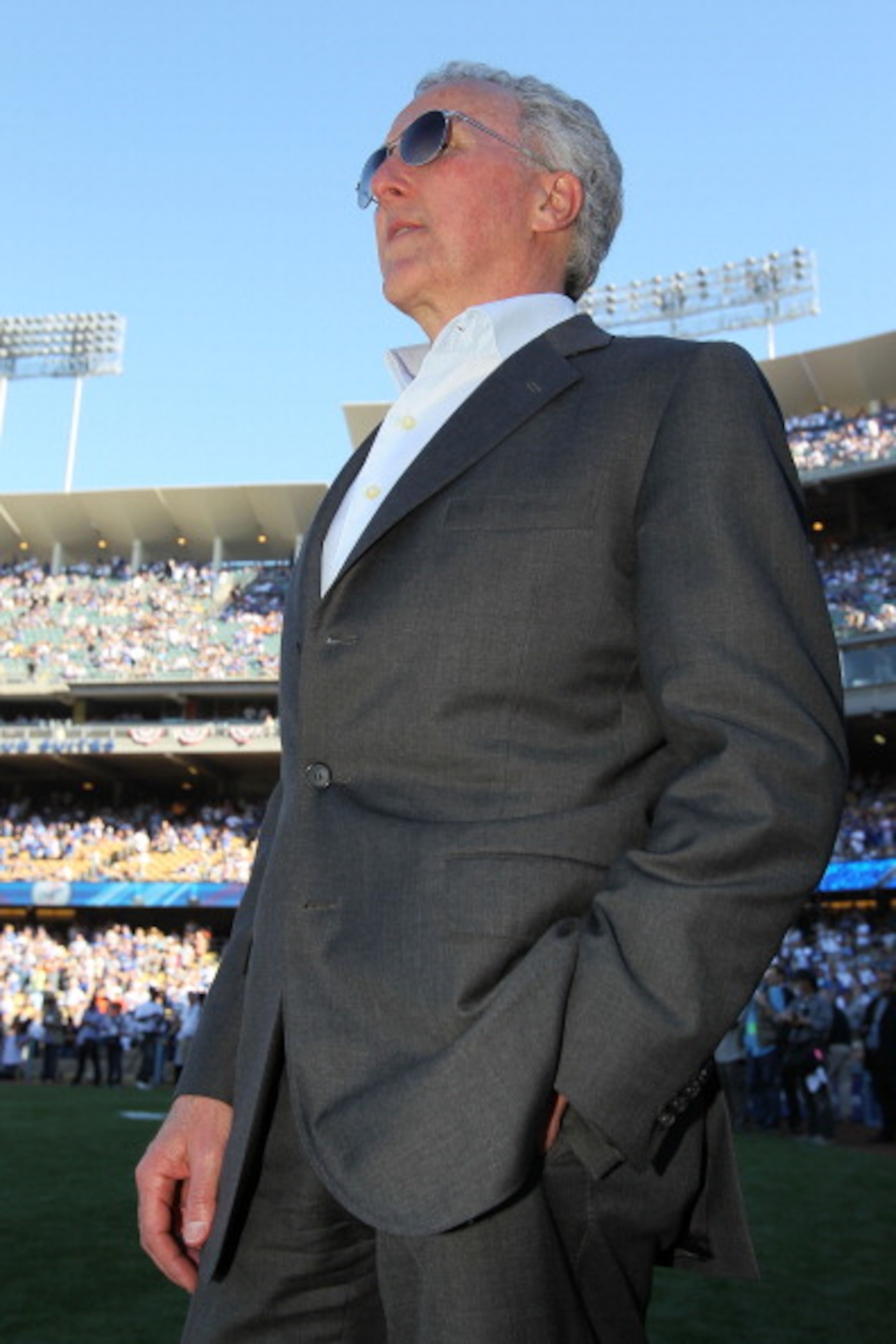LOS ANGELES, CA - MARCH 31:  Los Angeles Dodgers owner Frank McCourt stands on the field prior to their Opening Day game against the San Francisco Giants at Dodger Stadium on March 31, 2011 in Los Angeles, California.  (Photo by Jeff Gross/Getty Images)