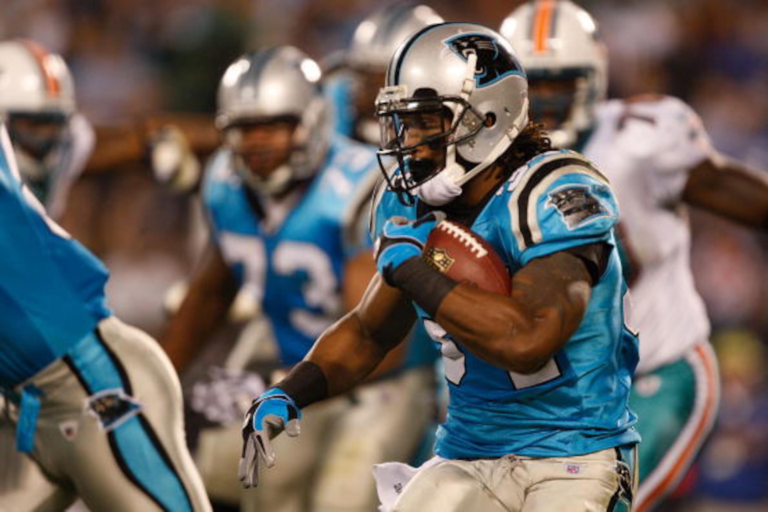 CHARLOTTE, NC - NOVEMBER 19:  DeAngelo Williams #34 of the Carolina Panthers runs with the ball against the Miami Dolphins during their game at Bank of America Stadium on November 19, 2009 in Charlotte, North Carolina.  (Photo by Streeter Lecka/Getty Imag