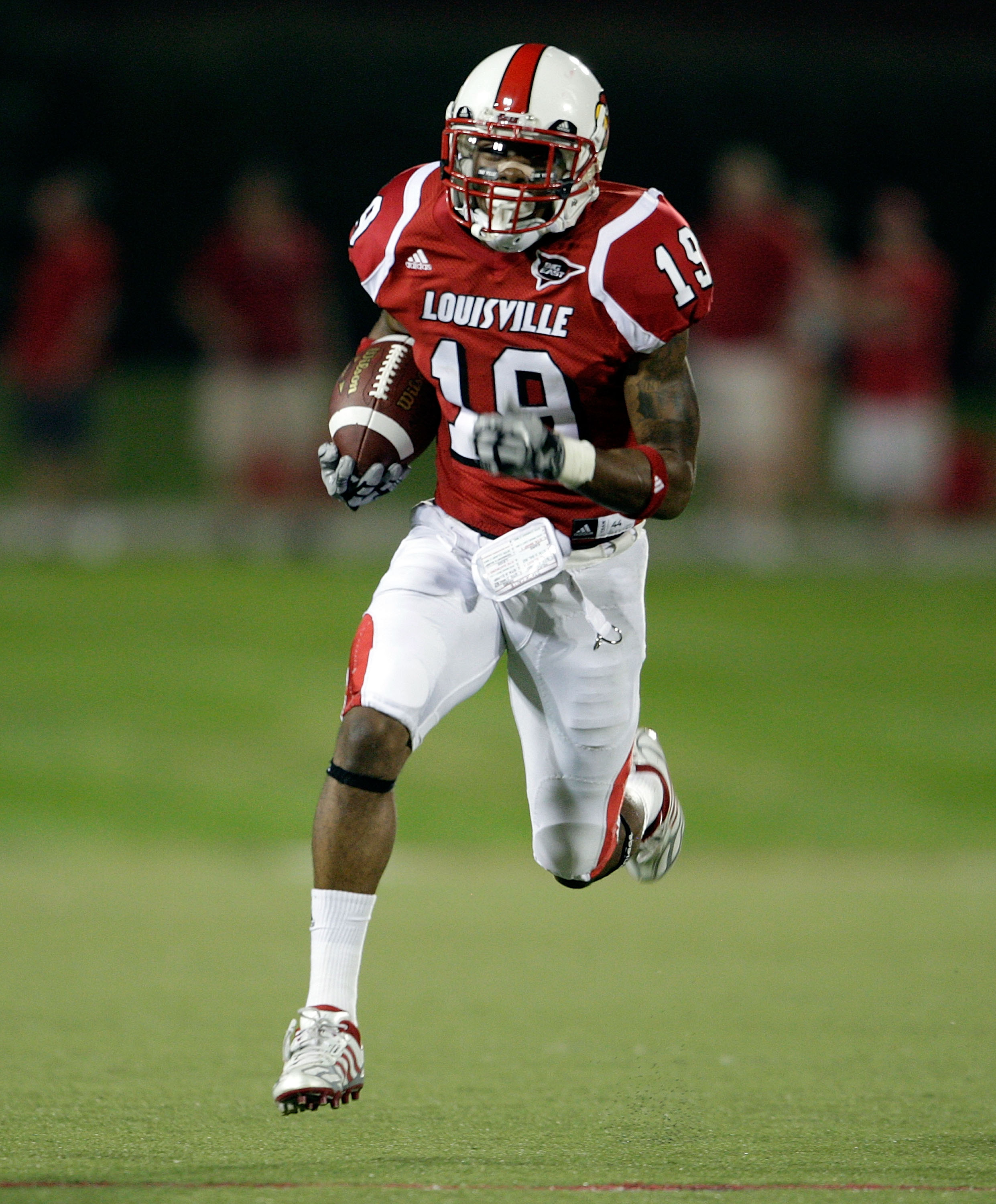 LOUISVILLE, KY - SEPTEMBER 05:  Johnny Patrick #19 of the Louisville Cardinals runs with the balll after intercepting a pass during the game against the Indiana State Sycamores at Papa John's Cardinal Stadium on September 5, 2009 in Louisville, Kentucky. 