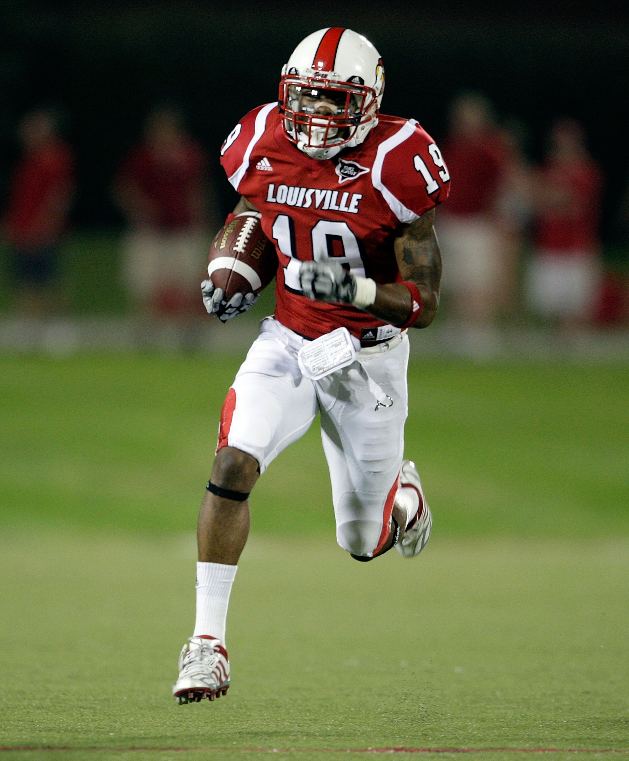 LOUISVILLE, KY - SEPTEMBER 05:  Johnny Patrick #19 of the Louisville Cardinals runs with the balll after intercepting a pass during the game against the Indiana State Sycamores at Papa John's Cardinal Stadium on September 5, 2009 in Louisville, Kentucky. 