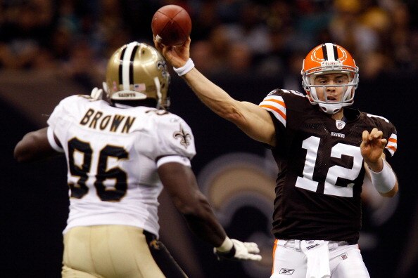 NEW ORLEANS - OCTOBER 24:  Colt McCoy #12 of the Cleveland Browns throws the ball over Alex Brown #96 of the New Orleans Saints at the Louisiana Superdome on October 24, 2010 in New Orleans, Louisiana.  The Browns defeated the Saints 30-17.  (Photo by Chr