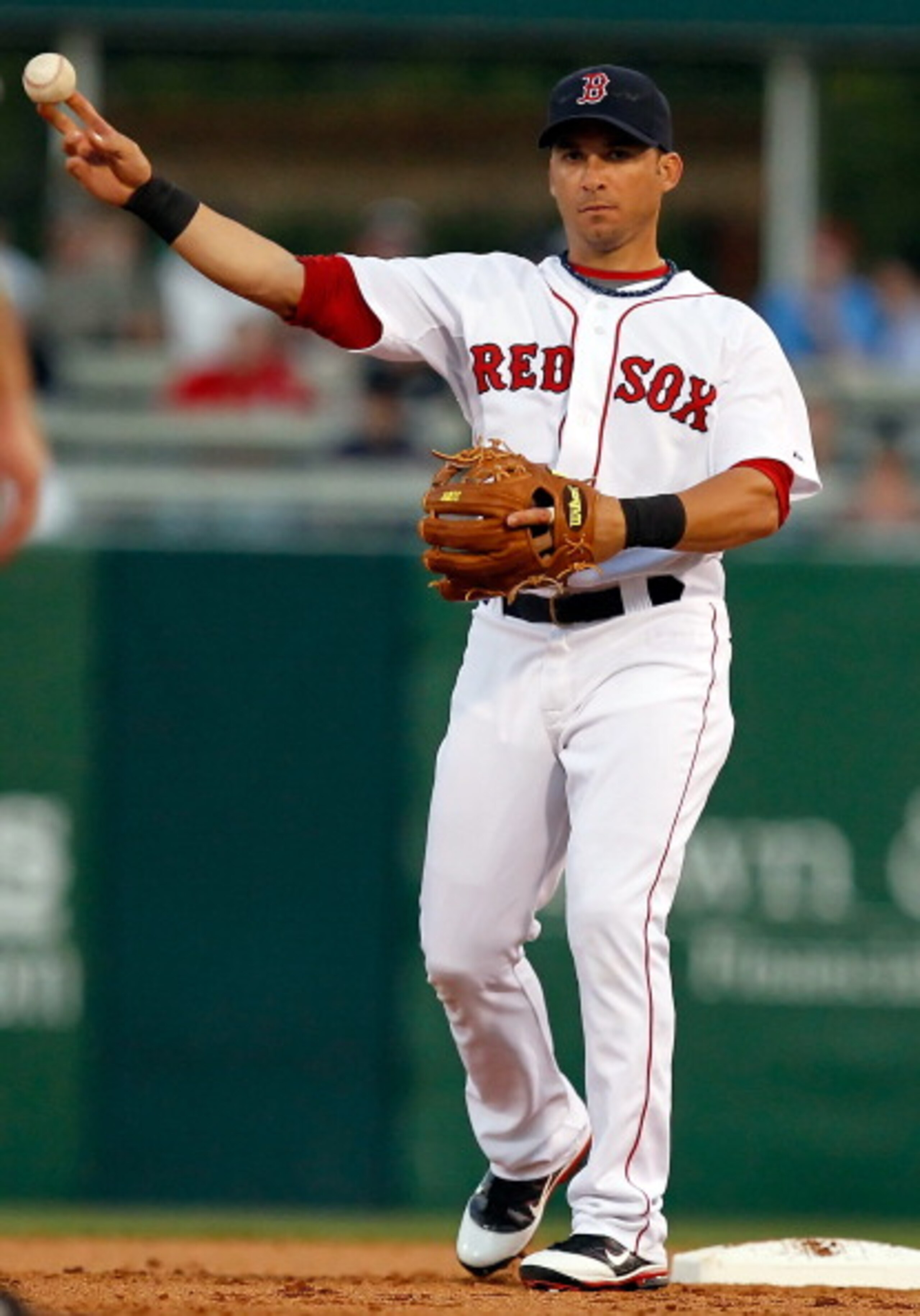 FORT MYERS, FL - MARCH 14:  Shortstop Marco Scutaro #16 of the Boston Red Sox throws the ball against the New York Yankees during a Grapefruit League Spring Training Game at City of Palms Park on March 14, 2011 in Fort Myers, Florida.  (Photo by J. Meric/