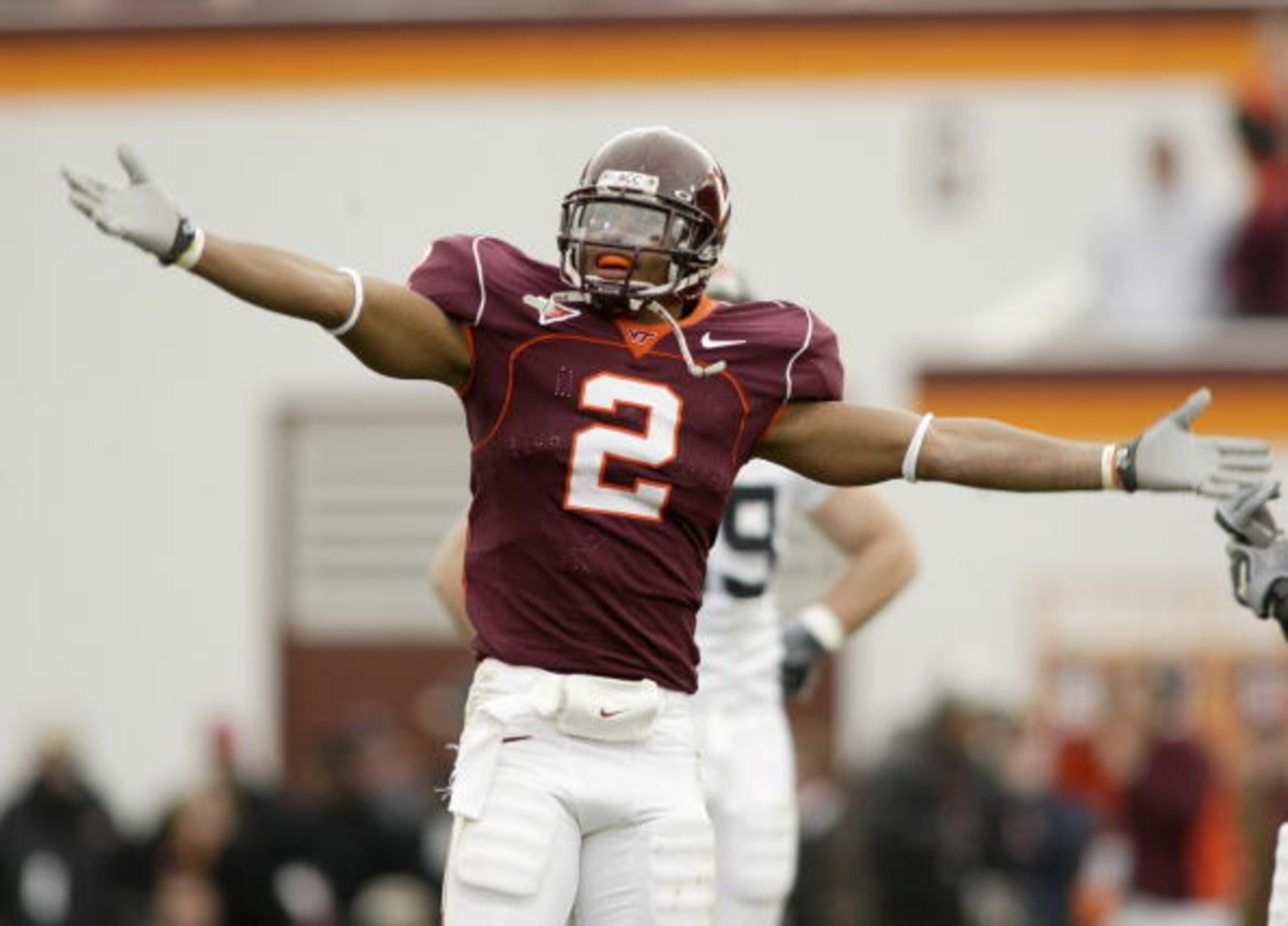 BLACKSBURG, VA - NOVEMBER 27:  Cornerback Jimmy F. Williams #2 of the Virginia Tech Hokies throws his hands up while facing the Virginia Cavaliers on November 27, 2004 at Lane Stadium in Blacksburg, Virginia. Virginia Tech defeated Virginia 24-10. (Photo