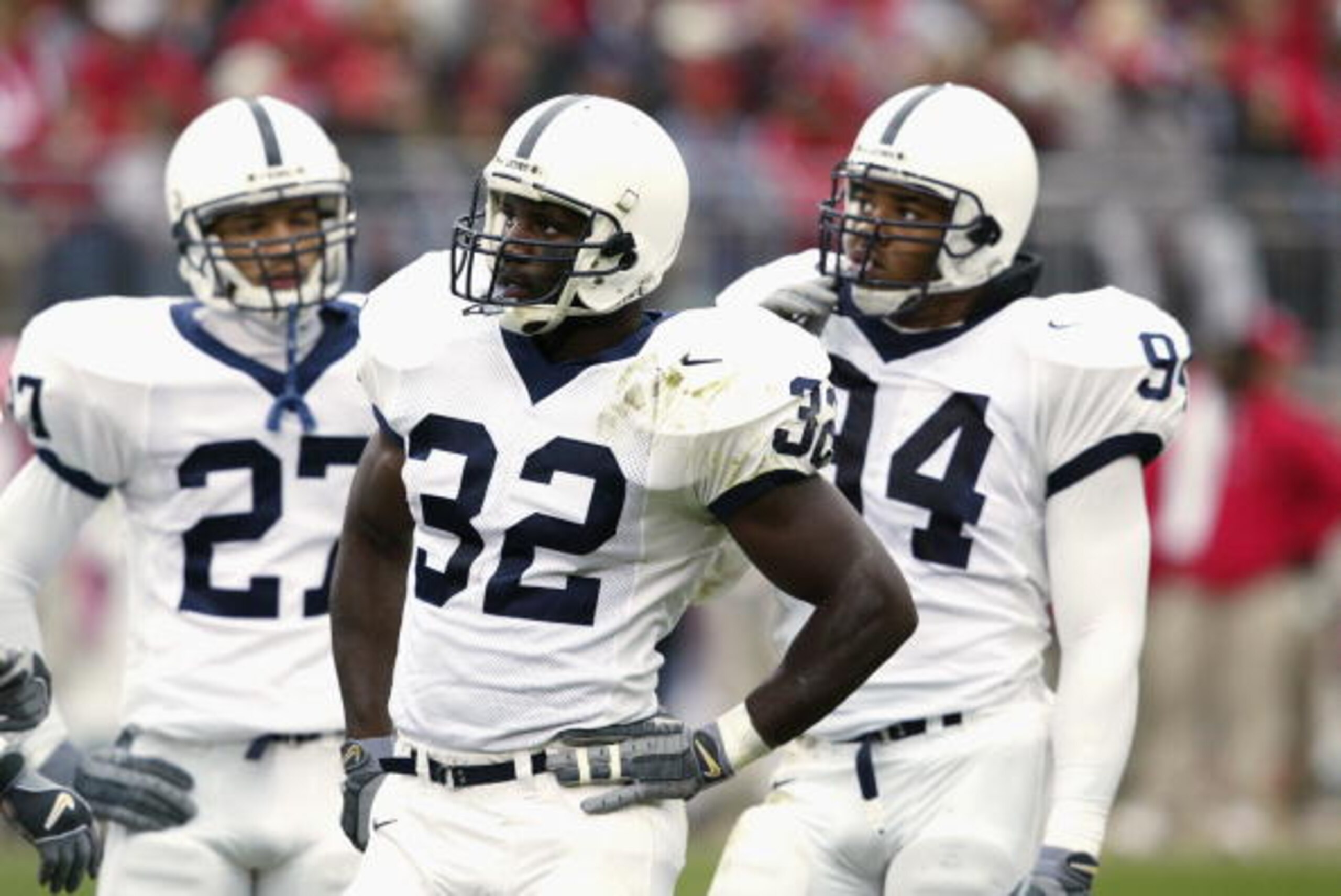 COLUMBUS - OCTOBER 26:  Penn State safety Chris Garrel #27, cornerback Bryan Scott #32 and linebacker Derek Wake #94 stand on the field during the NCAA football game against Ohio State at Ohio Stadium on October 26, 2002 in Columbus, Ohio.  The Ohio State