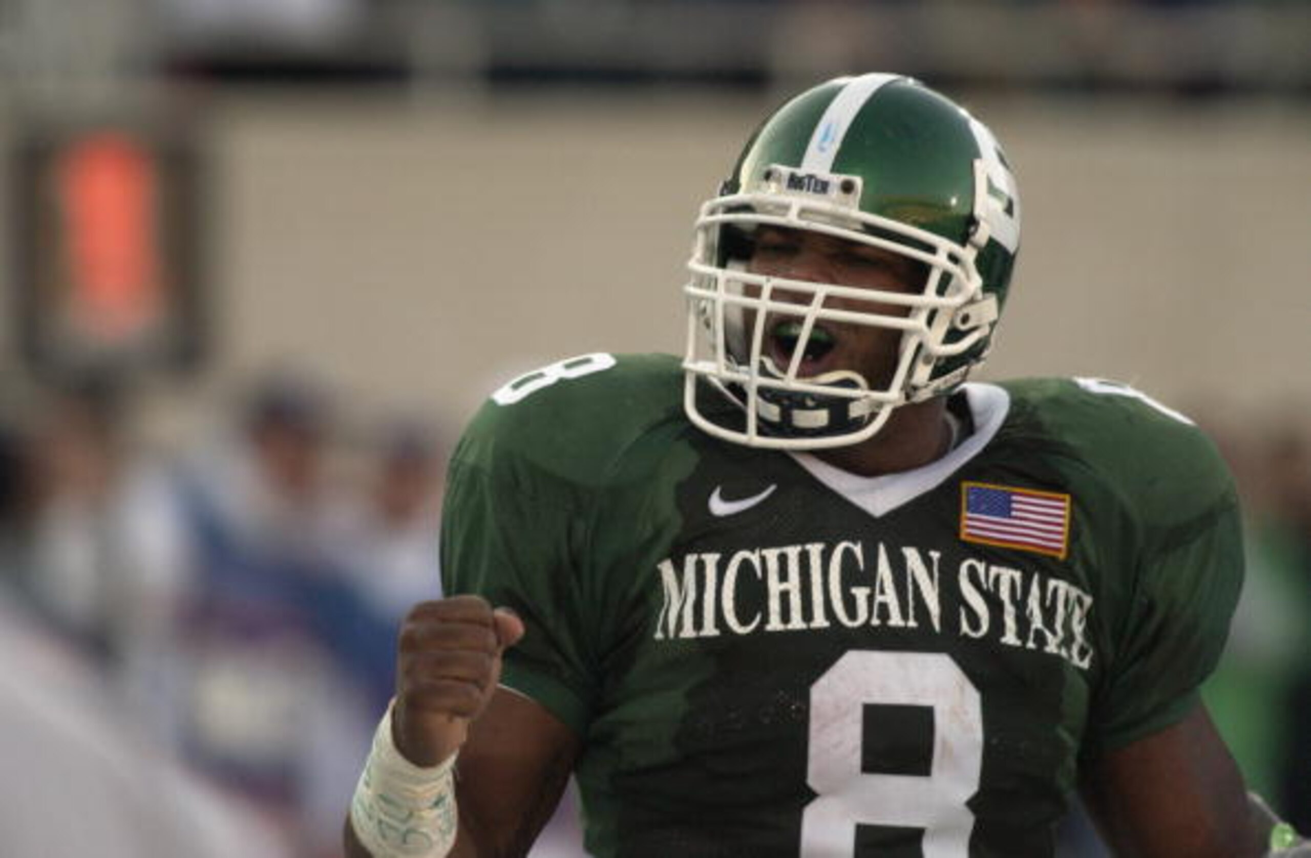 EAST LANSING, MI - NOVEMBER 3:  Running back TJ Duckett #8 of the Michigan State Spartans celebrates during the Big Ten Conference football game against the Michigan Wolverines on November 3, 2001 at Spartan Stadium in East Lansing, Michigan.  The Spartan