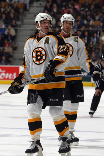 TORONTO - OCTOBER 24:  Glen Murray #27 and Joe Thornton #18 of the Boston Bruins wait for play during a game against the Toronto Maple Leafs at the Air Canada Centre October 24, 2005 in Toronto, Ontario. The Leafs beat the Bruins 5-4 in a shootout.  (Phot