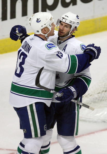 CHICAGO - MARCH 29: Mats Sundin #13 and Ryan Kesler #17 of the Vancouver Canucks celebrate a third period goal against the Chicago Blackhawks on March 29, 2009 at the United Center in Chicago, Illinois. The Canucks defeated the Blackhawks 4-0. (Photo by J