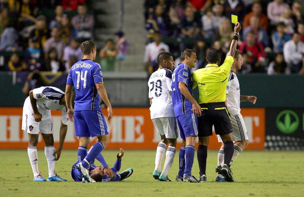 CARSON, CA - AUGUST 28: Davey Arnaud #22 of the Kansas City Wizards appeals for the red card as Sean Franklin #28 of the Los Angeles Galaxy looks on while referee Yader Reyes issues the yellow card to Chris Birchall #11 of the Los Angeles Galaxy for a har
