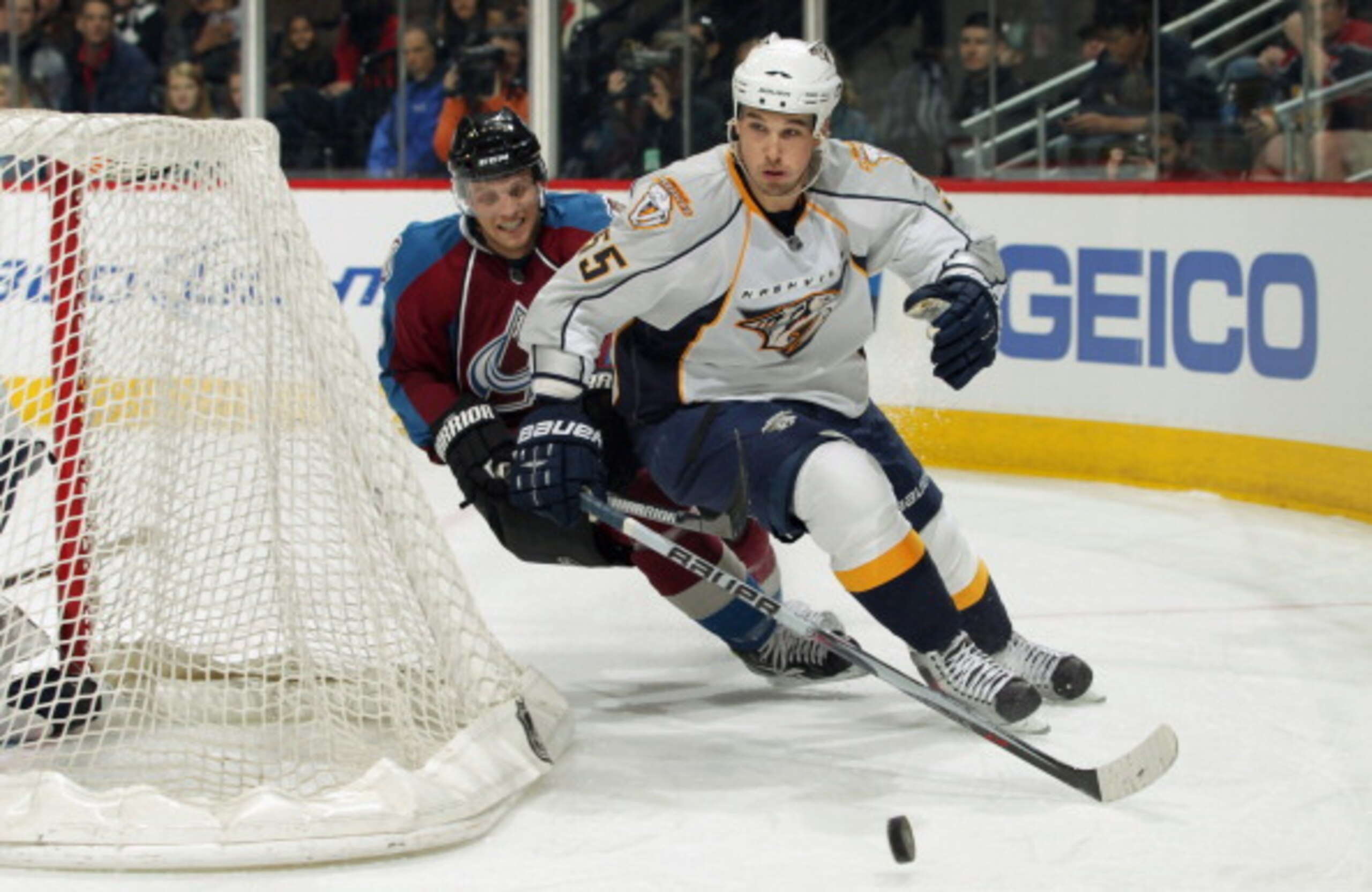 DENVER, CO - MARCH 31:  Shane O'Brien #55 of the Nashville Predators looks to control the puck as Jay McClement #16 of the Colorado Avalanche pursues the play at the Pepsi Center on March 31, 2011 in Denver, Colorado.  (Photo by Doug Pensinger/Getty Image