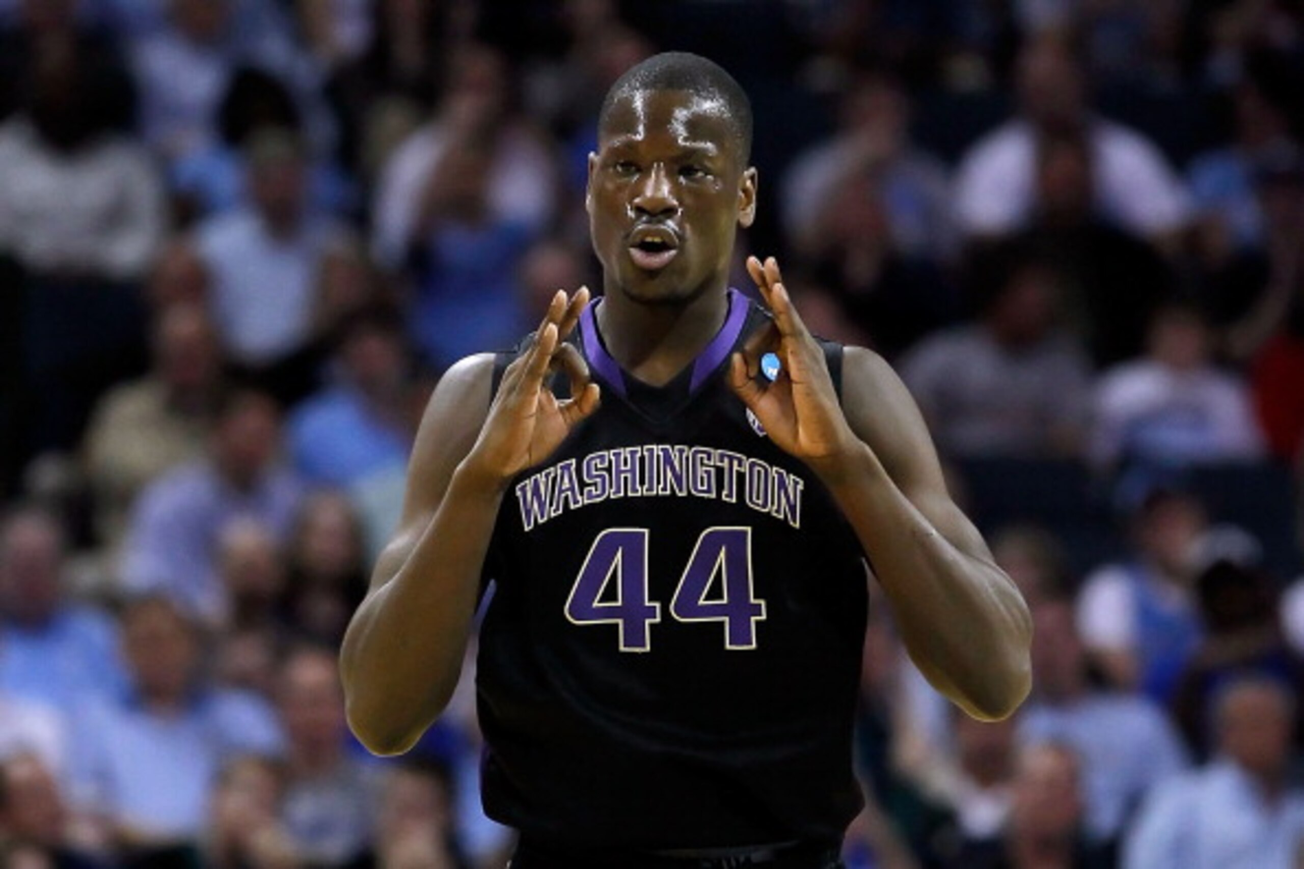 CHARLOTTE, NC - MARCH 20: Darnell Gant #44 of the Washington Huskies reacts in the first half while taking on the North Carolina Tar Heels during the third round of the 2011 NCAA men's basketball tournament at Time Warner Cable Arena on March 20, 2011 in CHARLOTTE, NC - MARCH 20: Darnell Gant #44 of the Washington Huskies reacts in the first half while taking on the North Carolina Tar Heels during the third round of the 2011 NCAA men's basketball tournament at Time Warner Cable Arena on March 20, 2011 in