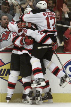 5 May 2001:  The New Jersey Devils celebrate following Jason Arnott's game-tying goal during the second period of game 5 of the NHL Eastern Conference Semifinals against the Toronto Maple Leafs at Continental Airlines Arena at the Meadowlands in East Ruth