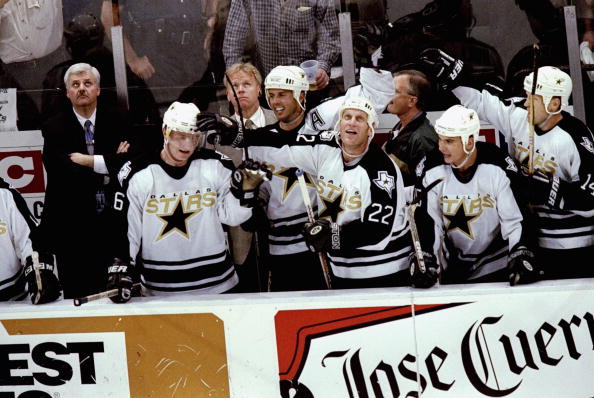 4 Jun 1999: Brett Hull #22 of the Dallas Stars with teammate Mike Modano #9 congradulate Jere Lehtinen #26  during game seven of the Western Confrence Finals against the Colorado Avalanche at the Reunion Arena in Dallas, Texas. The Stars defeated the Aval