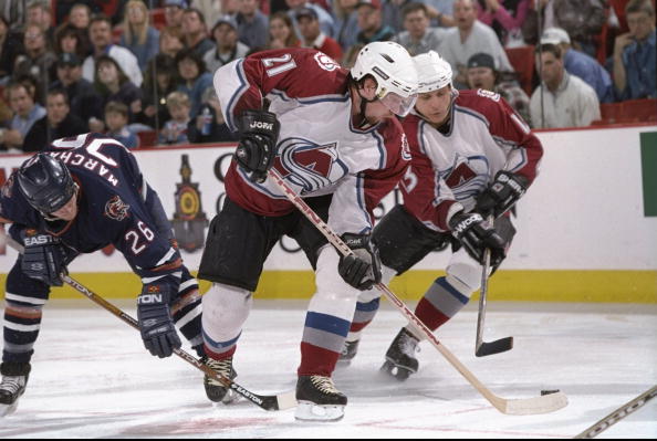 24 Apr 1998:  Center Peter Forsberg and leftwinger Valeri Kamensky of the Colorado Avalanche in action against leftwinger Todd Marchant of the Edmonton Oilers (lefT) during the playoffs round 1 game 2 at the Nichols Sports Arena in Denver, Colorado.  The