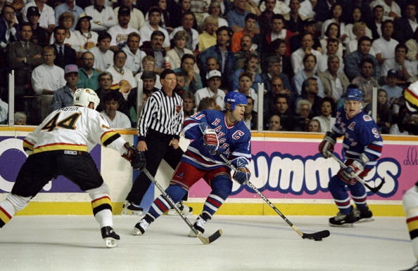 Jun 1994:  Mark Messier #11 of the New York Rangers takes control of the puck during the Stanley Cup Finals against the Vancover Canucks at the Pacific Coliseum in Vancover, Canada. Mandatory Credit: Mike Powell  /Allsport