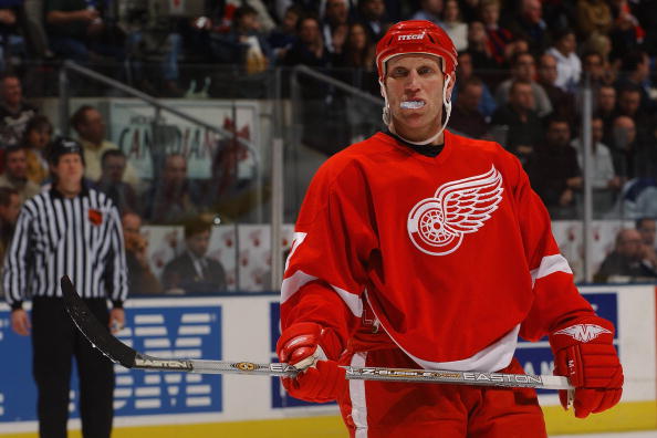 TORONTO - DECEMBER 6:  Brett Hull #17 of the Detroit Red Wings plays with his mouth piece as he looks on during a break in the game against the Toronto Maple Leafs at Air Canada Centre on December 6, 2003 in Toronto, Ontario.  The Maple Leafs defeated the