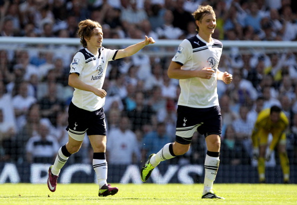 LONDON, ENGLAND - APRIL 09:  Luka Modric of Spurs celebrates scoring their second goal with team mate Roman Pavlyuchenko during the Barclays Premier League match between Tottenham Hotspur and Stoke City at White Hart Lane on April 9, 2011 in London, Engla