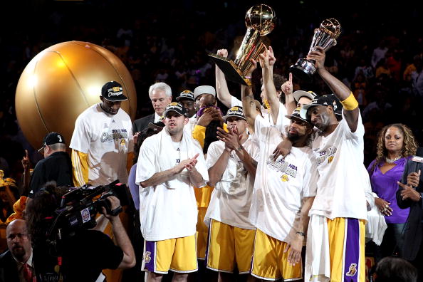 LOS ANGELES, CA - JUNE 17:  Derek Fisher #2 and Kobe Bryant #24 of the Los Angeles Lakers hold up the Larry O'Brien trophy and the MVP trophy after the Lakers defeated the Boston Celtics in Game Seven of the 2010 NBA Finals at Staples Center on June 17, 2