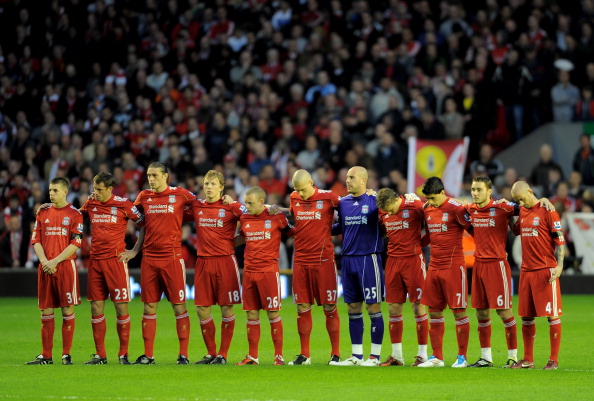 LIVERPOOL, ENGLAND - APRIL 11:  The Liverpool  players acknowledge a minutes silence in memory of the victims of the Hillsborough disaster prior to the Barclays Premier League match between Liverpool and Manchester City at Anfield on April 11, 2011 in Liv