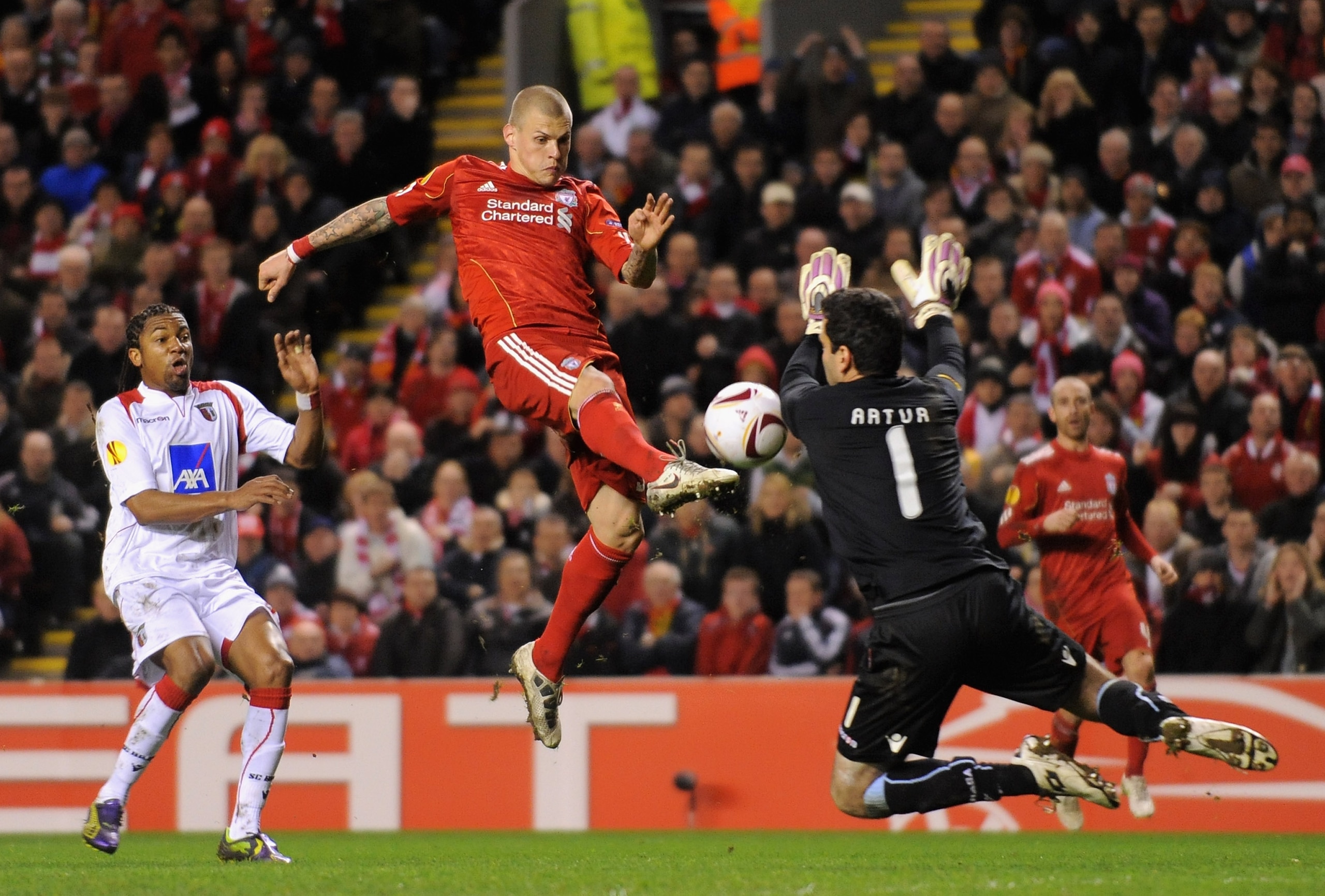 LIVERPOOL, ENGLAND - MARCH 17:  Martin Skrtel of Liverpool has a shot saved by Artur Moraes of SC Braga during the UEFA Europa League Round of 16 second leg match between Liverpool and SC Braga at Anfield on March 17, 2011 in Liverpool, England.  (Photo b