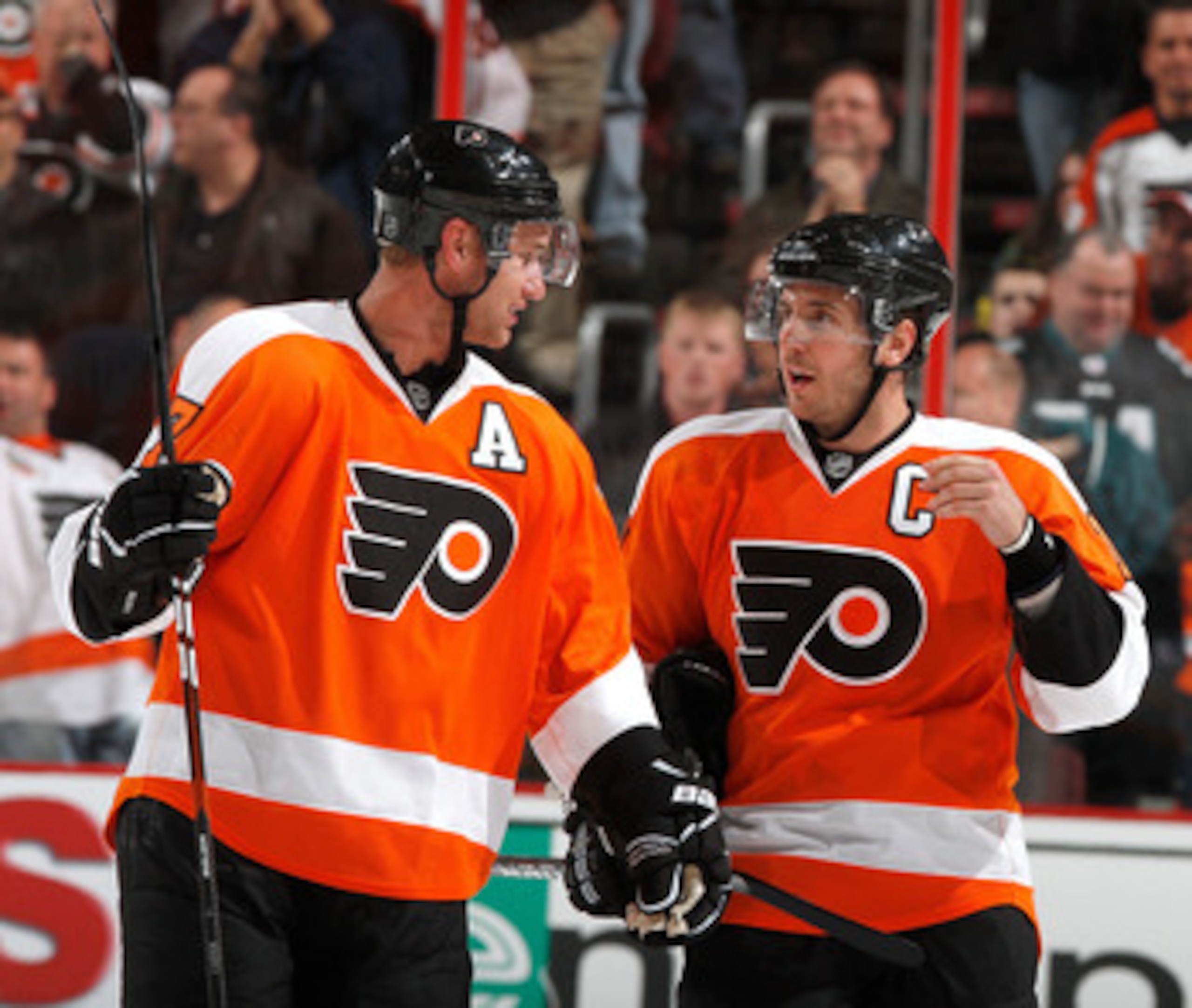 PHILADELPHIA, PA - FEBRUARY 03:  Jeff Carter #17 and Mike Richards #18 of the Philadelphia Flyers talk during a break in action in an NHL hockey game against the Nashville Predators at the Wells Fargo Center on February 3, 2011 in Philadelphia, Pennsylvan