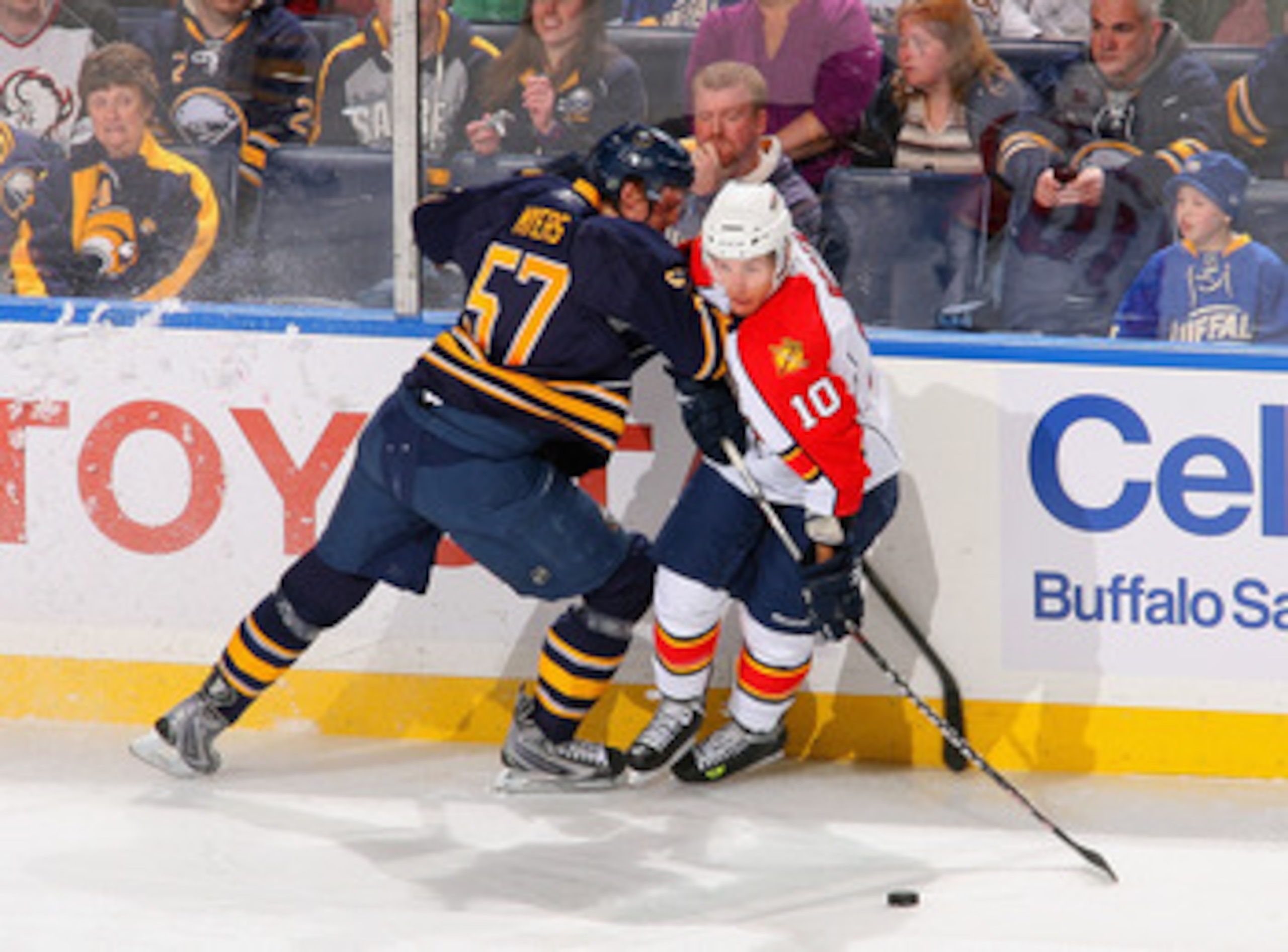BUFFALO, NY - MARCH 25: David Booth #10 of the Florida Panthers looks to make a play as he is checked by Tyler Myers #57 of the Buffalo Sabres at HSBC Arena on March 25, 2011 in Buffalo, New York.  (Photo by Rick Stewart/Getty Images)