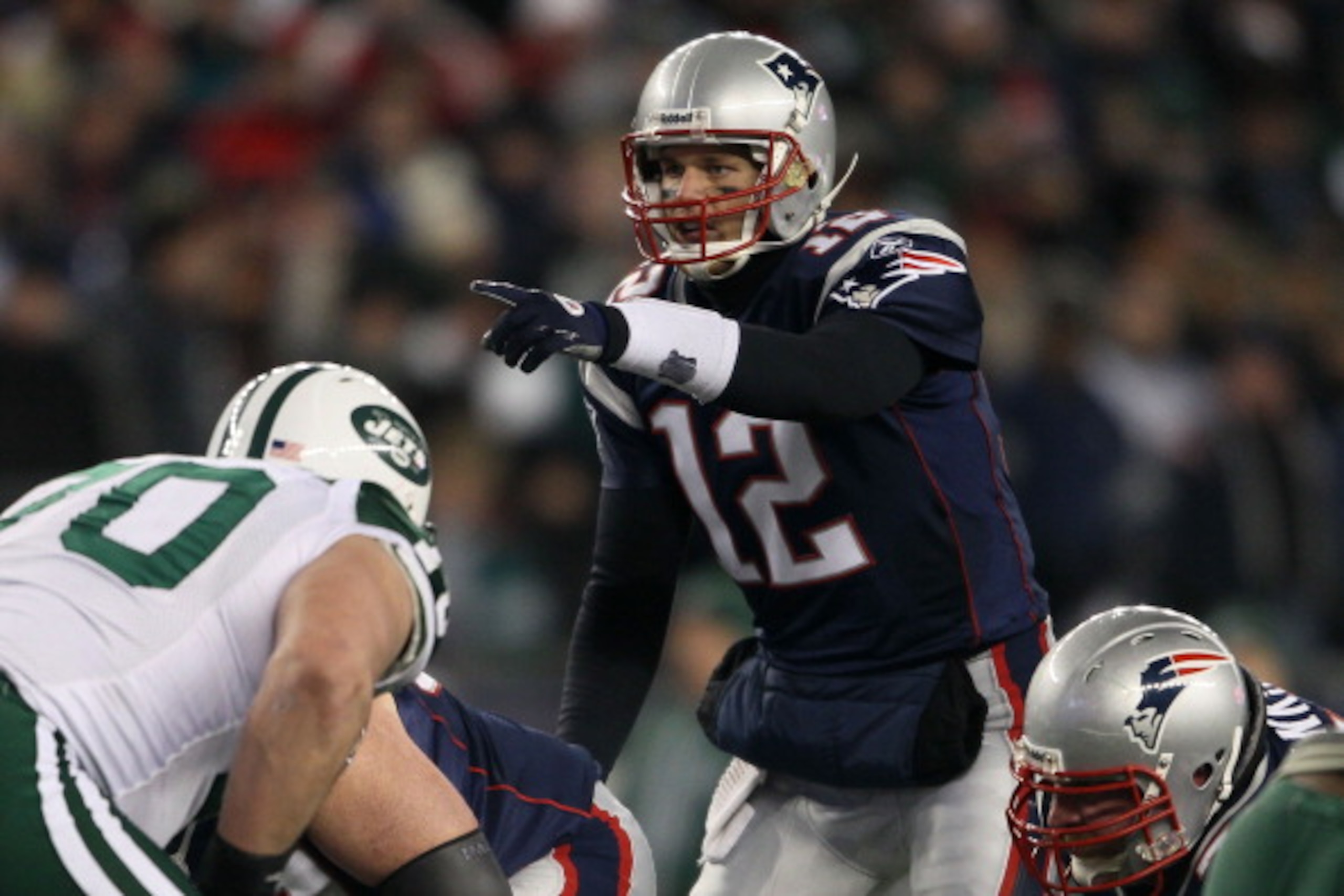 FOXBORO, MA - JANUARY 16:  Quarterback Tom Brady #12 of the New England Patriots signals during their 2011 AFC divisional playoff game against the New York Jets at Gillette Stadium on January 16, 2011 in Foxboro, Massachusetts.  (Photo by Elsa/Getty Image