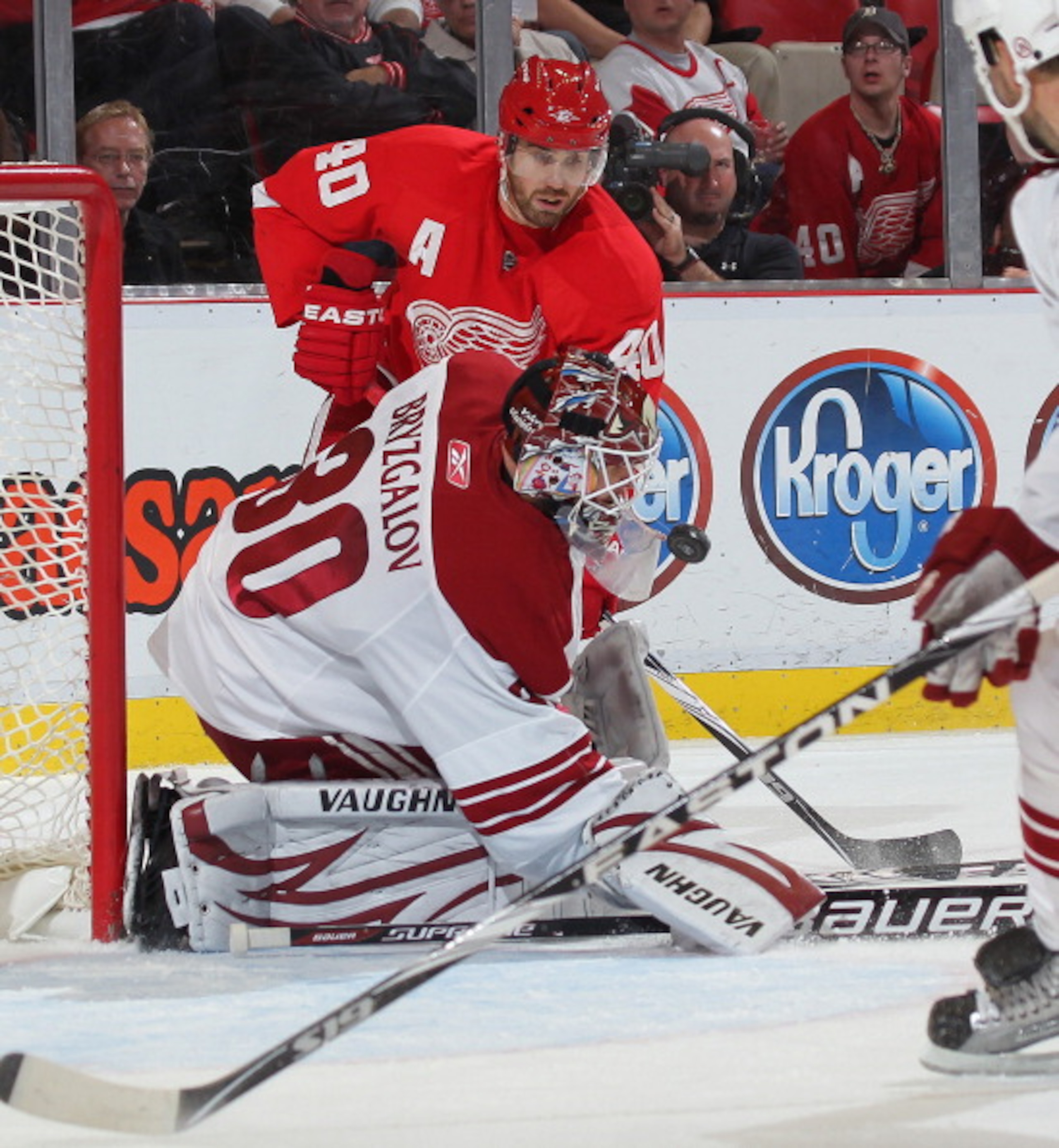 DETROIT,MI - NOVEMBER 8:  Henrik Zetterberg #40 of the Detroit Red Wings tries to get a puck past IIya Bryzgalov #30 of the Phoenix Coyotes in a game on November 8,2010 at the Joe Louis Arena in Detroit, Michigan. The Wings defeated the Coyotes 3-2 in ove