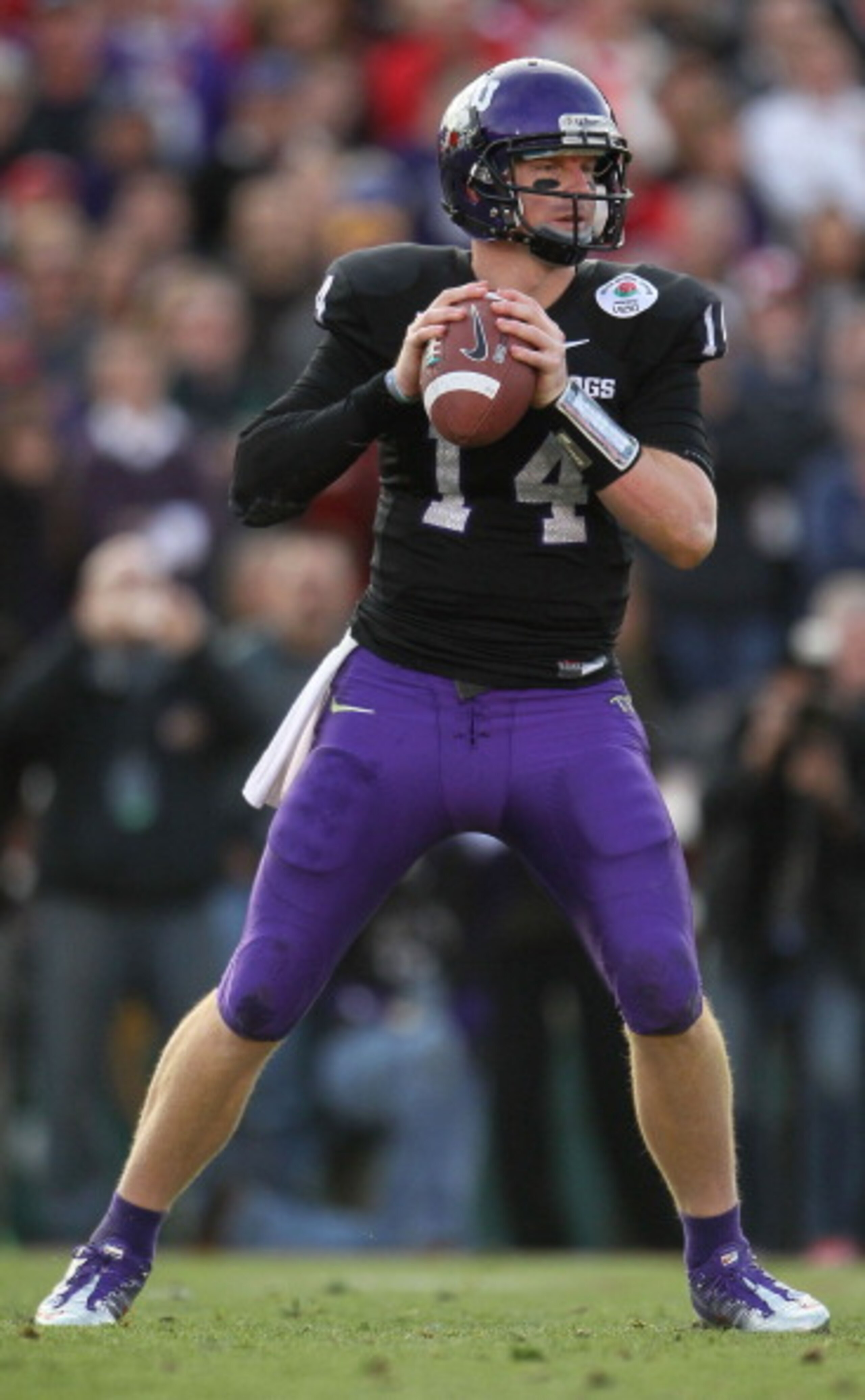 PASADENA, CA - JANUARY 01:  Quarterback Andy Dalton #14 of the TCU Horned Frogs looks to pass against the Wisconsin Badgers in the 97th Rose Bowl game on January 1, 2011 in Pasadena, California.  (Photo by Jeff Gross/Getty Images)
