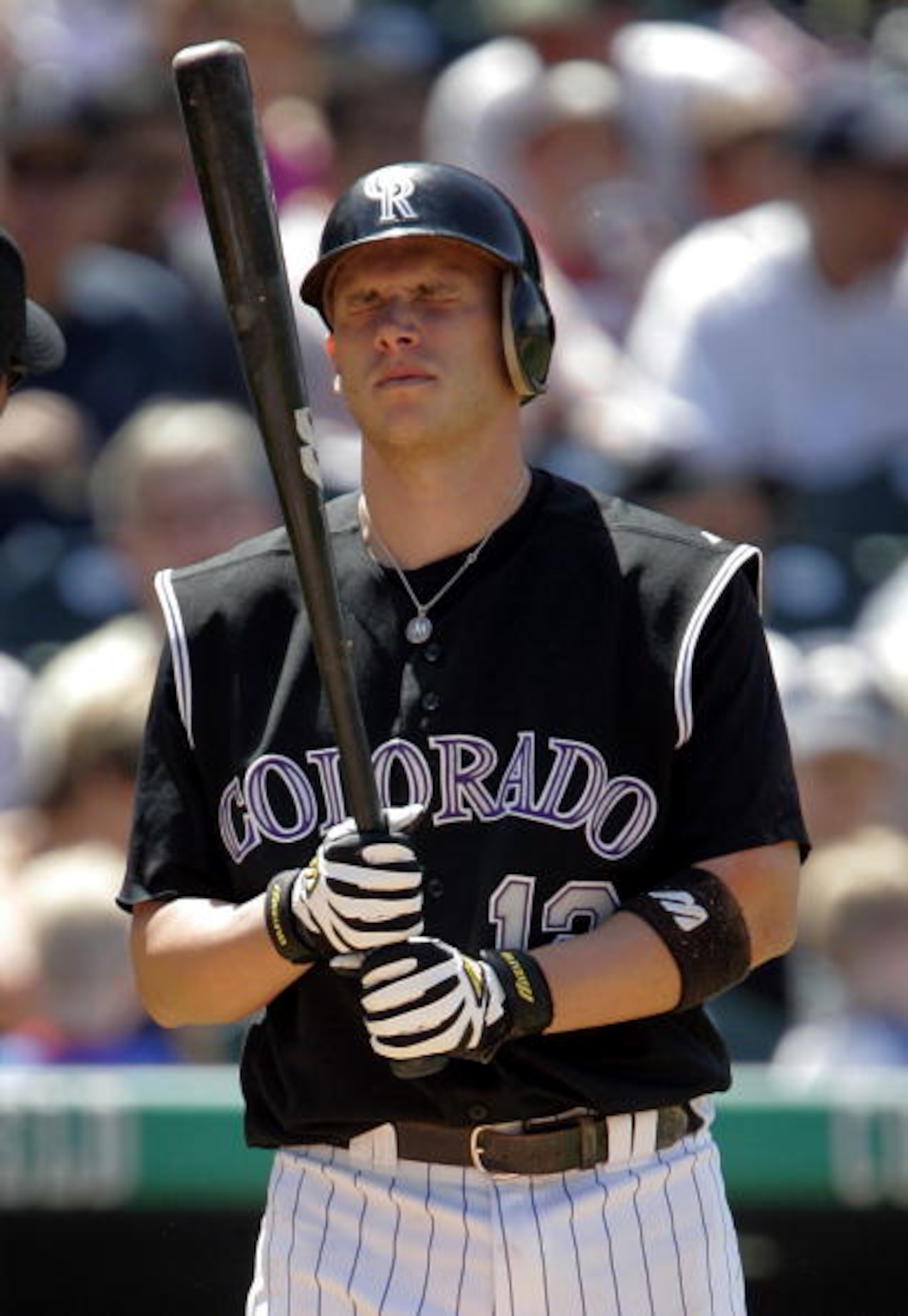 DENVER - MAY 15: Clint Barmes #12 of the Colorado Rockies grimaces after fouling a pitch off himself against the Arizona Diamondbacks on May 15, 2005 at Coors Field in Denver, Colorado. The D-backs defeated the Rockies 5-4. (Photo by Brian Bahr/Getty Im DENVER - MAY 15: Clint Barmes #12 of the Colorado Rockies grimaces after fouling a pitch off himself against the Arizona Diamondbacks on May 15, 2005 at Coors Field in Denver, Colorado. The D-backs defeated the Rockies 5-4. (Photo by Brian Bahr/Getty Im