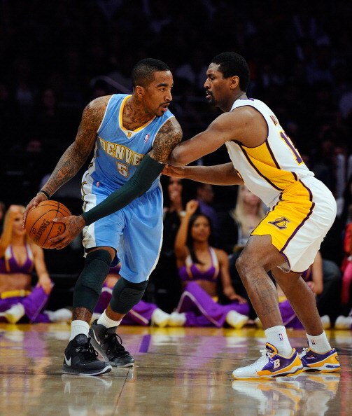 LOS ANGELES, CA - APRIL 03:  Ron Artest #15 of the Los Angeles Lakers defends against JR Smith #5 of the Denver Nuggets at Staples Center on April 3, 2011 in Los Angeles, California. NOTE TO USER: User expressly acknowledges and agrees that, by downloadin