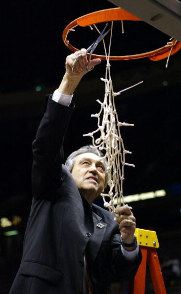 EAST RUTHERFORD, NJ - MARCH 27: Head coach Eddie Sutton of the Oklahoma State Cowboys celebrates by cutting down the net after defeating the St. Joseph's Hawks 64-62 during their fourth round regional game of the NCAA Division I Men's Basketball Tourname