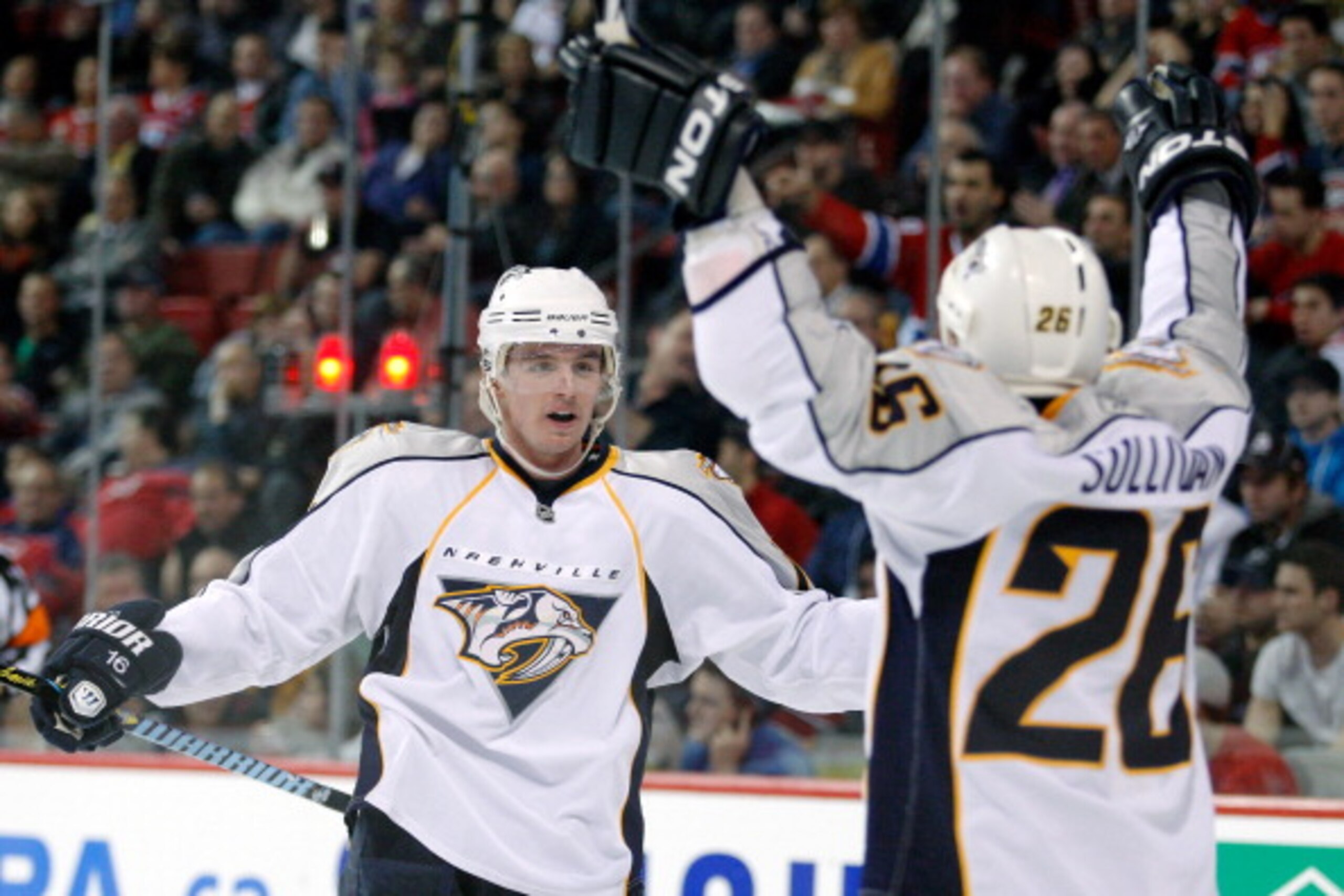 MONTREAL - NOVEMBER 18:  Cal O'Reilly #16 of the Nashville Predators celebrates his third period goal with team mate Steve Sullivan #26 during the NHL game against the Montreal Canadiens at the Bell Centre on November 18, 2010 in Montreal, Quebec, Canada.