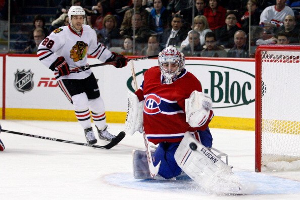 MONTREAL, CANADA - APRIL 5:  Carey Price #31 of the Montreal Canadiens makes a pad save on the puck during the NHL game against the Chicago Blackhawks at the Bell Centre on April 5, 2011 in Montreal, Quebec, Canada.  The Canadiens defeated the Blackhawks