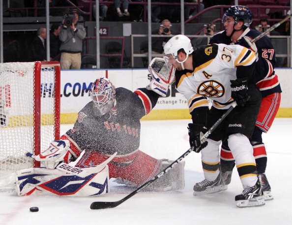 NEW YORK, NY - APRIL 04: Patrice Bergeron #37 of the Boston Bruins is stopped by Henrik Lundqvist #30 of the New York Rangers during the first period at Madison Square Garden on April 4, 2011 in New York City.  (Photo by Bruce Bennett/Getty Images)