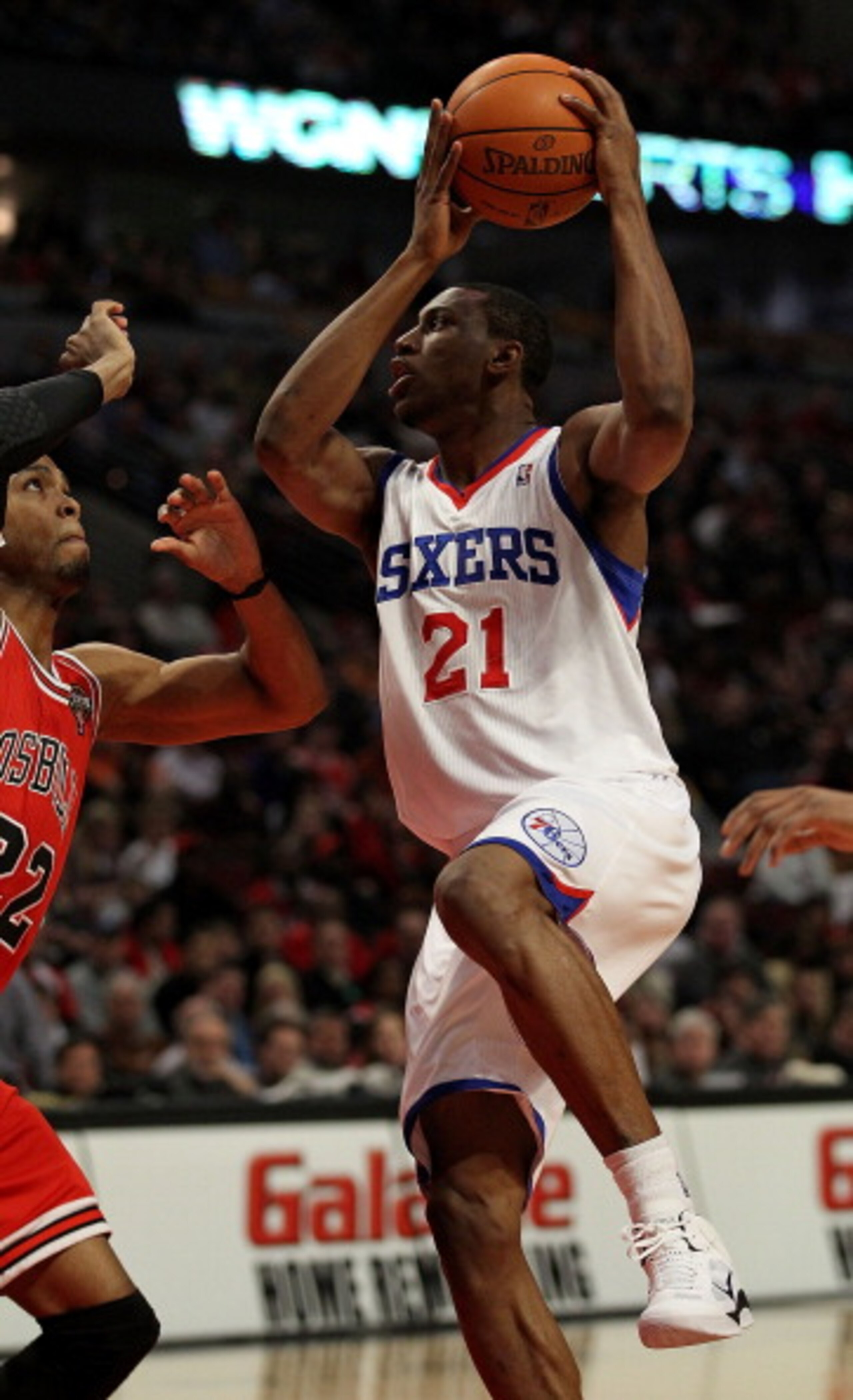 CHICAGO, IL - MARCH 28: Thaddeus Young #21 of the Philadelphia 76ers puts up for a shot against Taj Gibson #22 of the Chicago Bulls at the United Center on March 28, 2011 in Chicago, Illinois. NOTE TO USER: User expressly acknowledges and agrees that, by CHICAGO, IL - MARCH 28: Thaddeus Young #21 of the Philadelphia 76ers puts up for a shot against Taj Gibson #22 of the Chicago Bulls at the United Center on March 28, 2011 in Chicago, Illinois. NOTE TO USER: User expressly acknowledges and agrees that, by