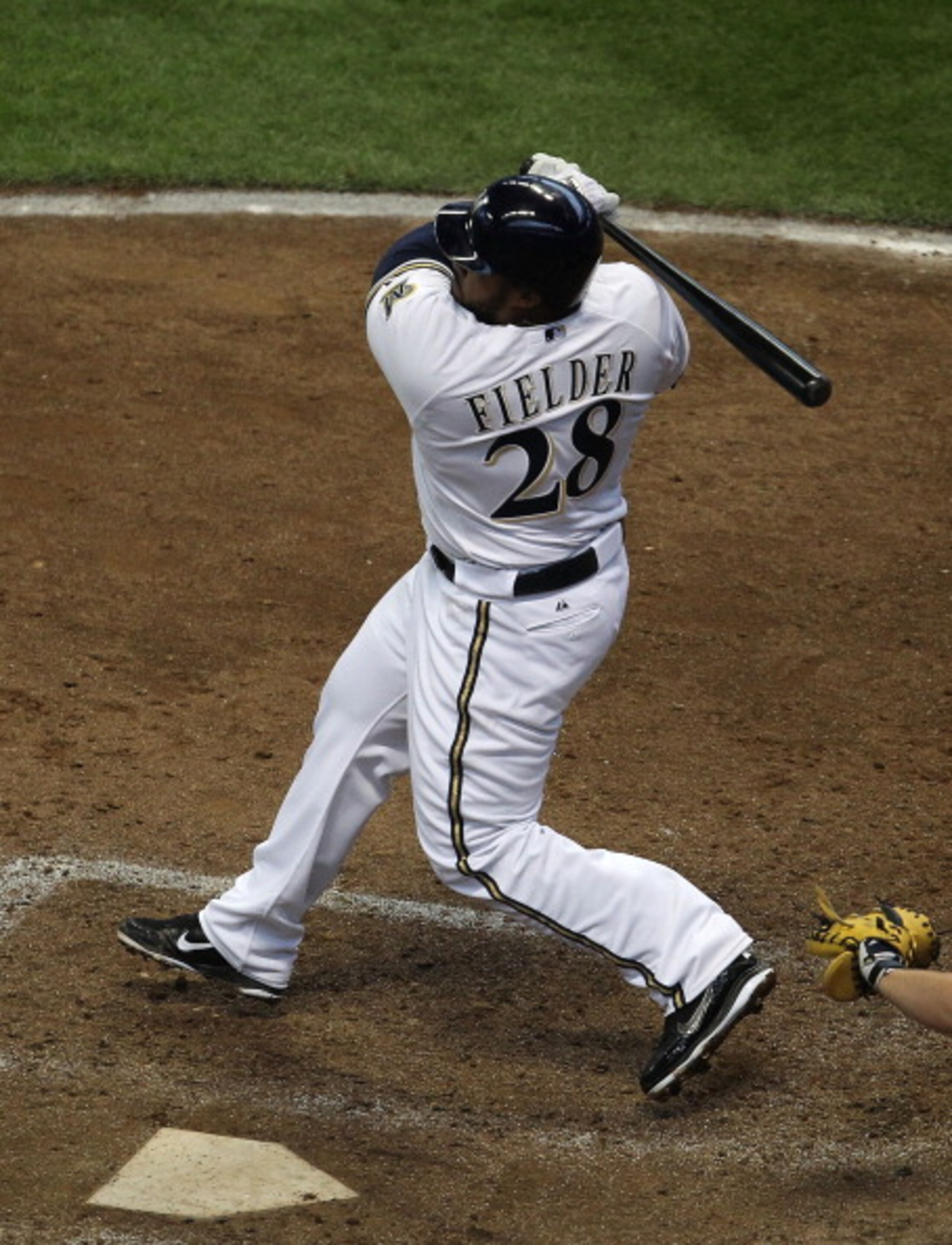 MILWAUKEE, WI - APRIL 04: Prince Fielder #28 of the Milwaukee Brewers hits the ball against the Atlanta Braves during the home opener at Miller Park on April 4, 2011 in Milwaukee, Wisconsin. The Braves defeated the Brewers 2-1. (Photo by Jonathan Daniel/G