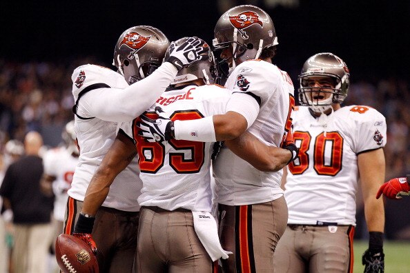 NEW ORLEANS, LA - JANUARY 02:  Quarterback Josh Freeman #5 celebrates after throwing a touchdown  with Dezmon Briscoe #89 of the Tampa Bay Buccaneers during the game against the New Orleans Saints at the Louisiana Superdome on January 2, 2011 in New Orlea