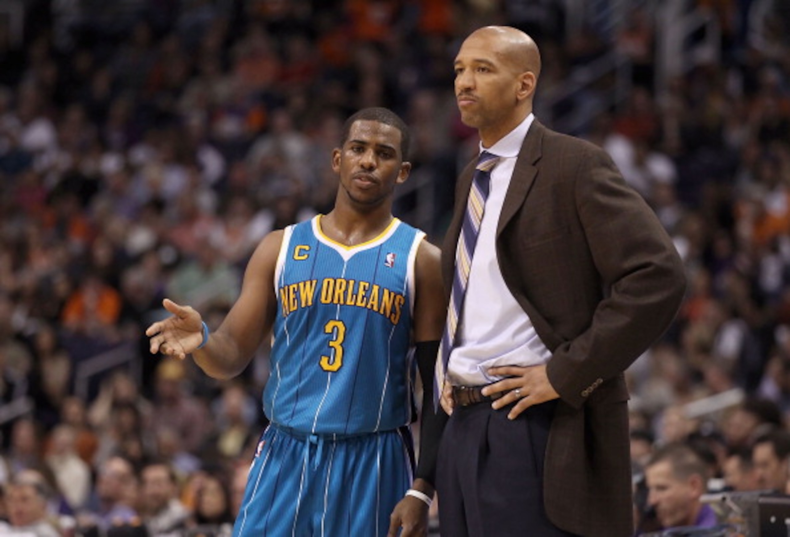 PHOENIX, AZ - JANUARY 30:  Chris Paul #3 of the New Orleans Hornets talks with head coach Monty Williams during the NBA game against the Phoenix Suns at US Airways Center on January 30, 2011 in Phoenix, Arizona. The Suns defeated the Hornets 104-102. NOTE