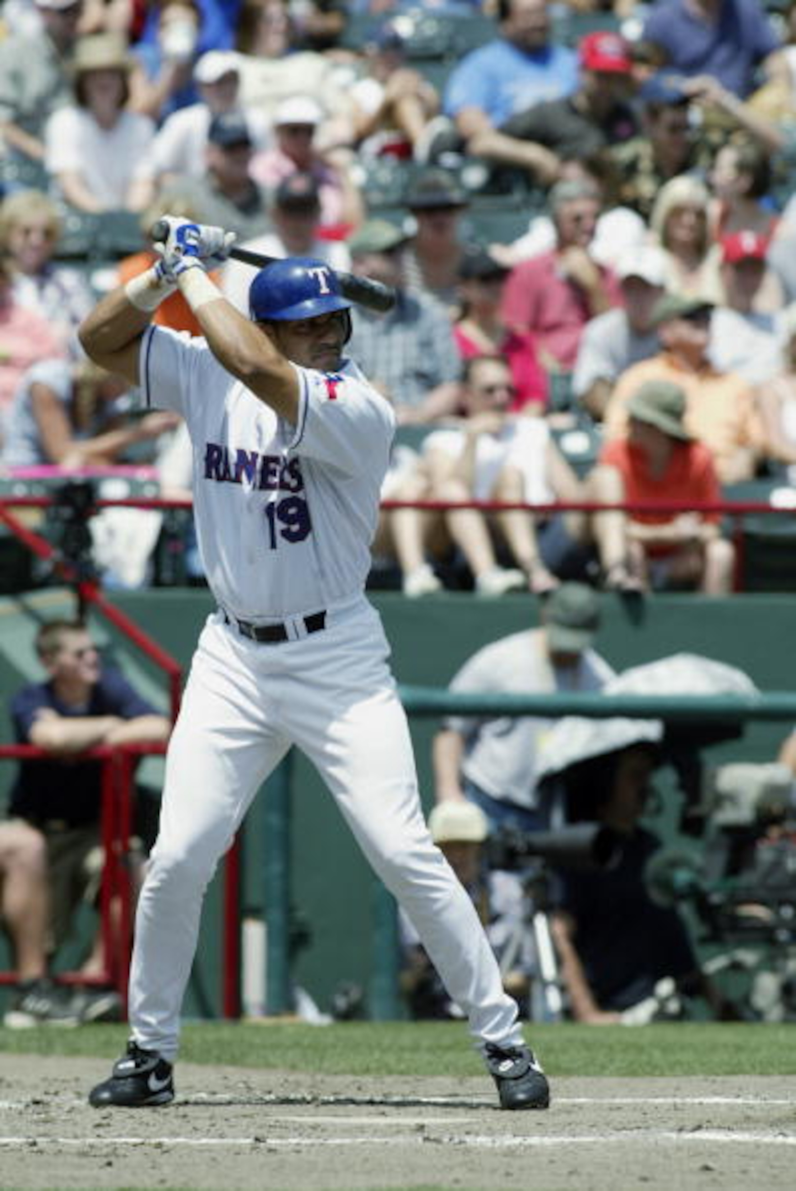 ARLINGTON, TX - MAY 11: Juan Gonzalez #19 of the Texas Rangers stands at bat during the game against the Cleveland Indians at the Ballpark in Arlington on May 11, 2003 in Arlington, Texas. The Rangers defeated the Indians 17-10. (Photo by Ronald Martin ARLINGTON, TX - MAY 11: Juan Gonzalez #19 of the Texas Rangers stands at bat during the game against the Cleveland Indians at the Ballpark in Arlington on May 11, 2003 in Arlington, Texas. The Rangers defeated the Indians 17-10. (Photo by Ronald Martin