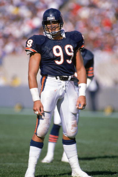 CHICAGO - OCTOBER 2:  Defensive tackle Dan Hampton #99 of the Chicago Bears looks on as he stands on the field during the game against the Buffalo Bills at Soldier Field on October 2, 1988 in Chicago, Illinois.  The Bears won 24-3.  (Photo by Jonathan Dan