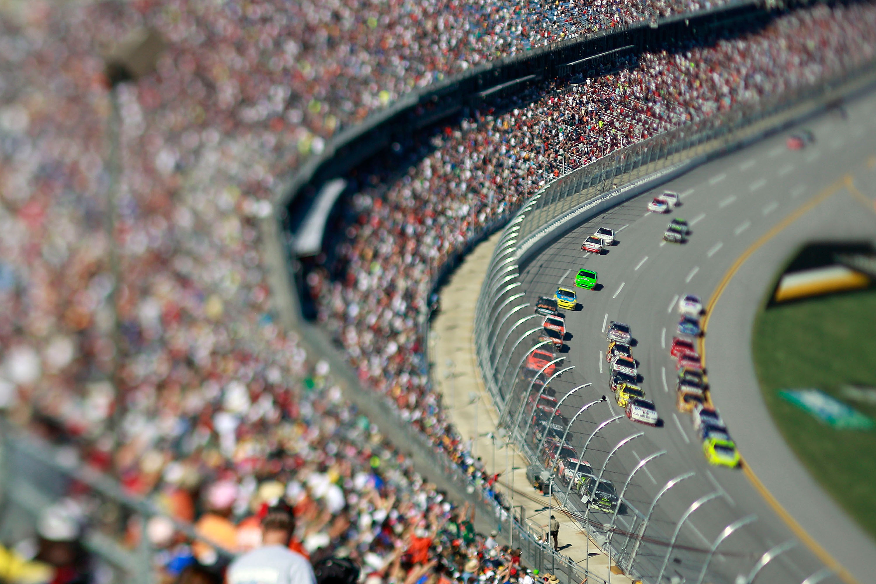TALLADEGA, AL - OCTOBER 31:  (***EDITORS NOTE*** - THIS DIGITAL IMAGE WAS CREATED WITH THE USE OF VARIABLE FOCAL PLANE LENS) Cars race through the tri-oval during the NASCAR Sprint Cup Series AMP Energy Juice 500 at Talladega Superspeedway on October 31,
