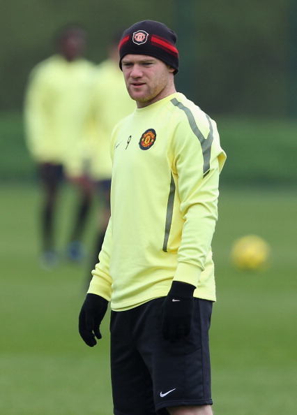 MANCHESTER, ENGLAND - APRIL 11:  Wayne Rooney of Manchester United looks on during a training session ahead of their UEFA Champions League quarter final second leg match against Chelsea at the Carrington Training Complex on April 11, 2011 in Manchester, E