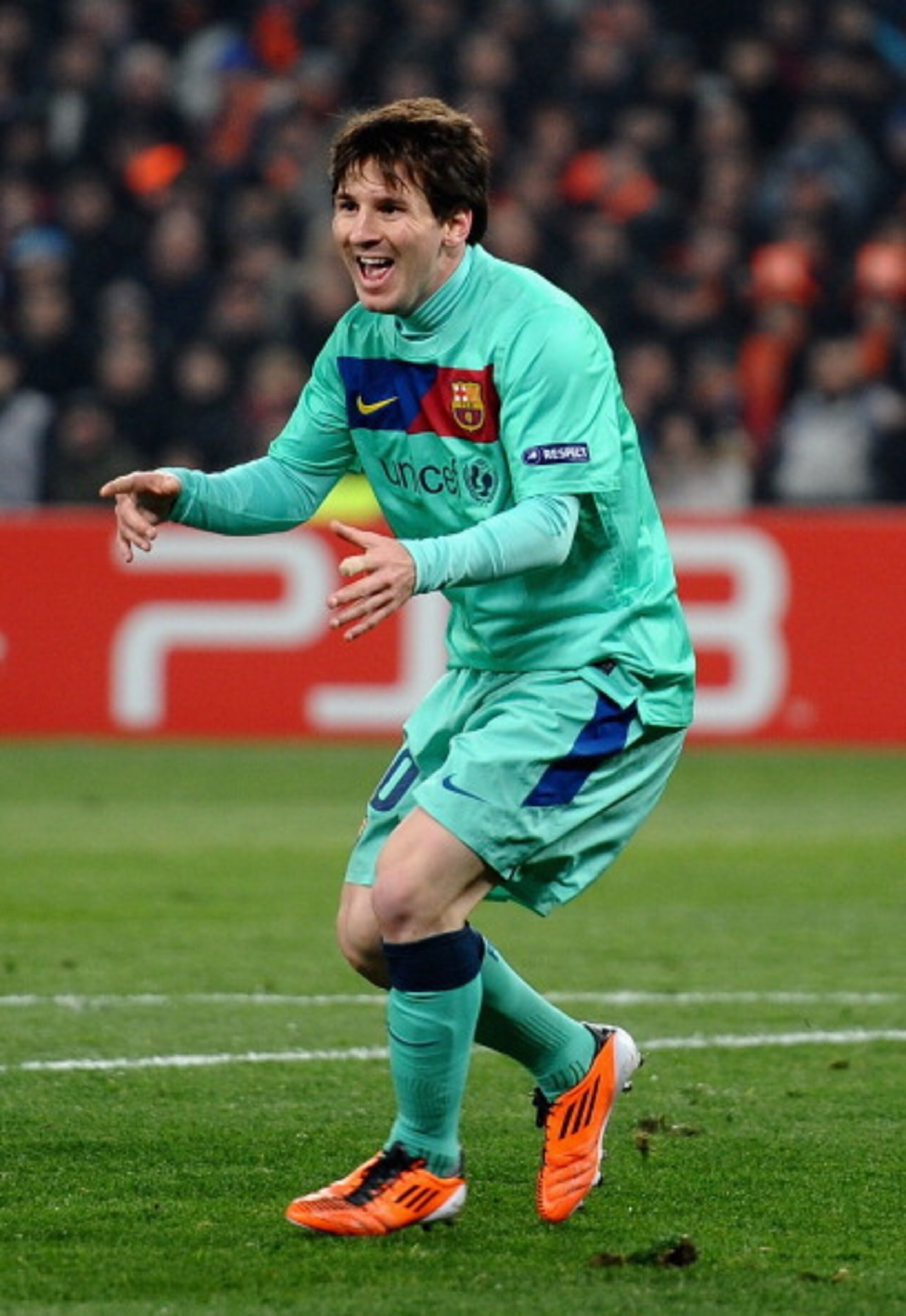 DONETSK, UKRAINE - APRIL 12:  Lionel Messi of Barcelona celebrates scoring the opening goal during the UEFA Champions League Quarter Final 2nd Leg match between Shakhtar Donetsk and Barcelona, at the Donbass Arena on April 12, 2011 in Donetsk, Ukraine.  (