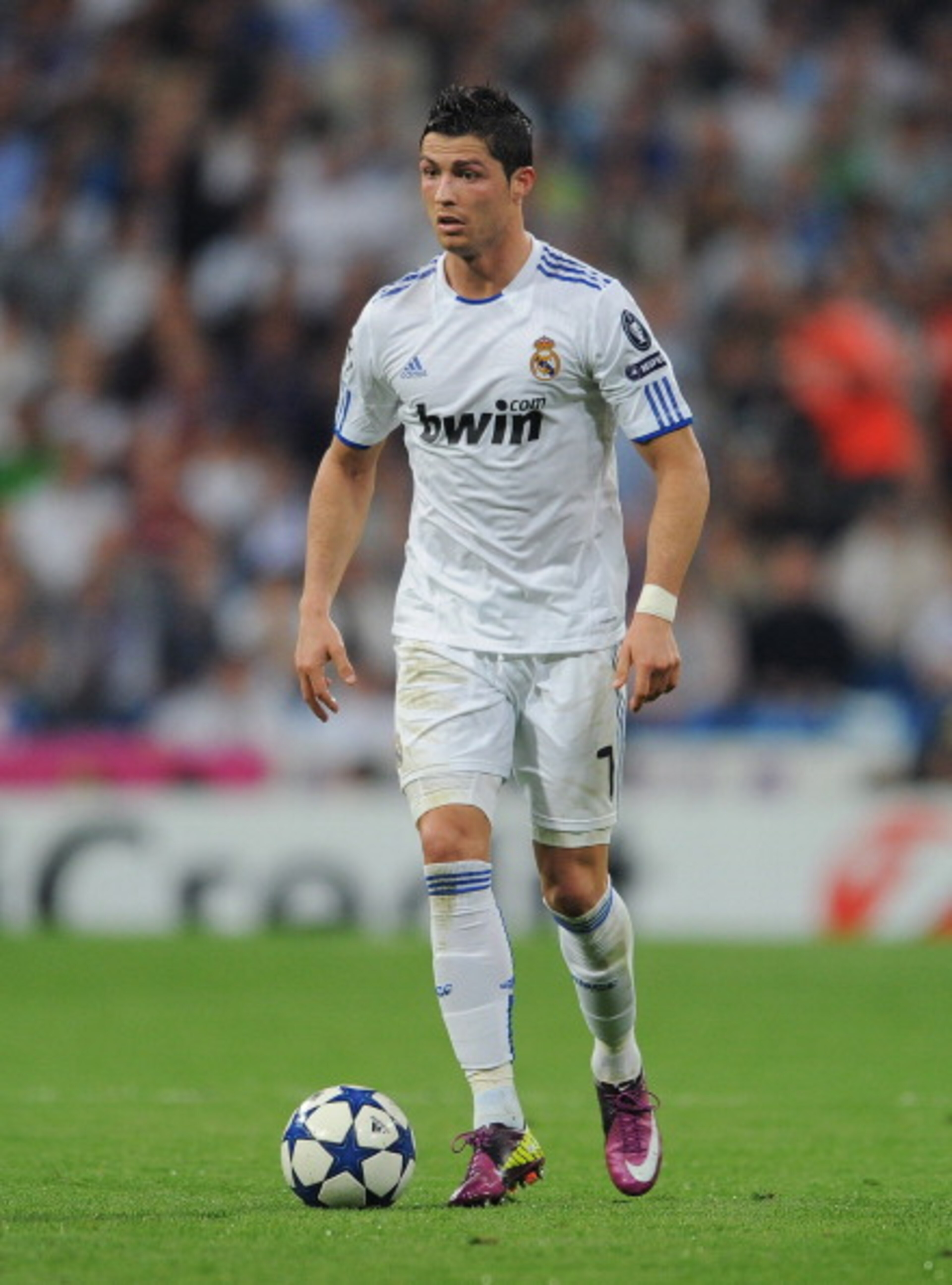 MADRID, SPAIN - APRIL 05:  Cristiano Ronaldo of Real Madrid controls the ball during the UEFA Champions League quarter final first leg match between Real Madrid and Tottenham Hotspur at Estadio Santiago Bernabeu on April 5, 2011 in Madrid, Spain.  (Photo