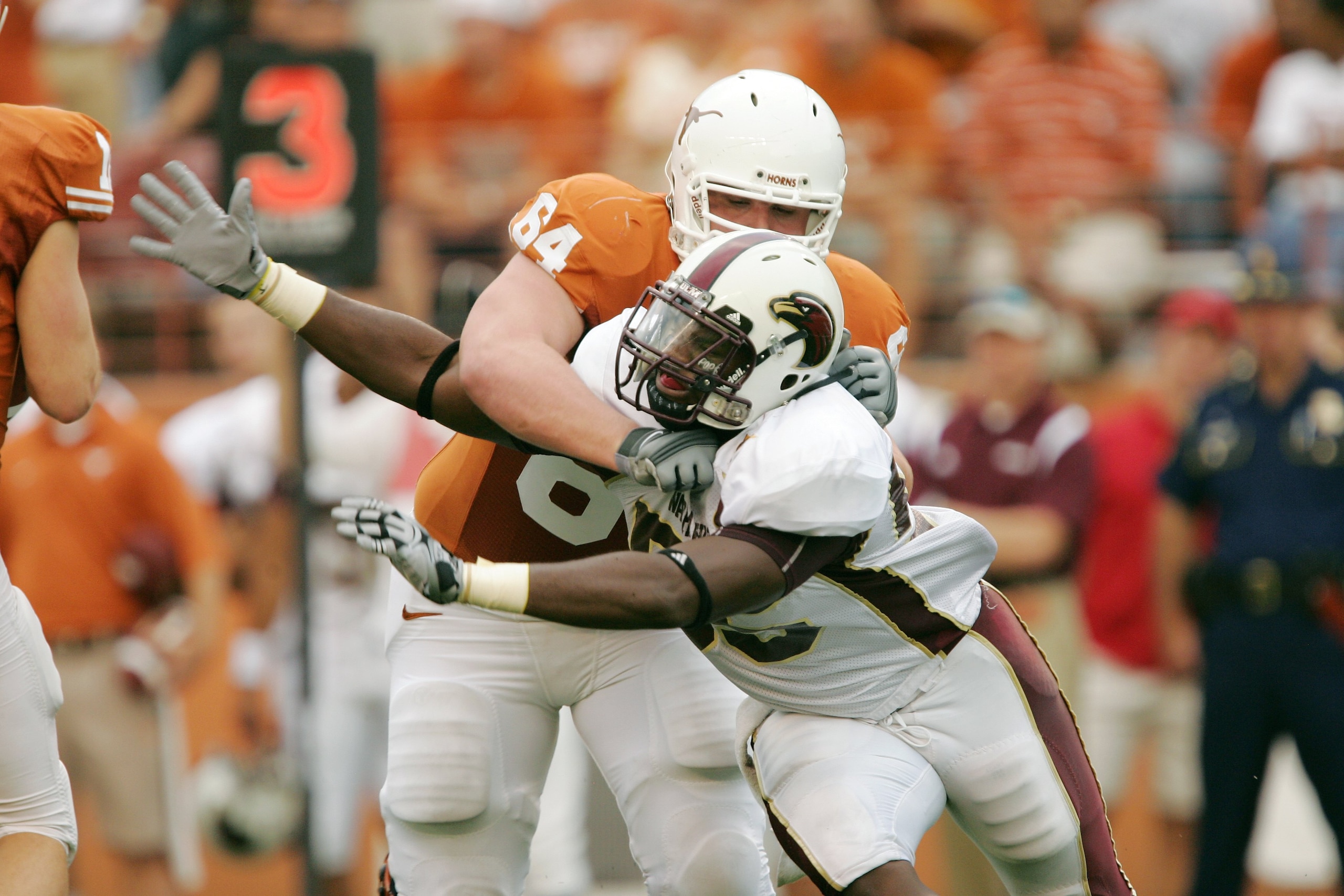 AUSTIN, TX - SEPTEMBER 5:  Defensive end Troy Evans #55 of the Louisiana Monroe Warhawks rushes the quarterback against outside tackle Kyle Hix #64 of the Texas Longhorns on September 5, 2009 at Darrell K Royal-Texas Memorial Stadium in Austin, Texas. The