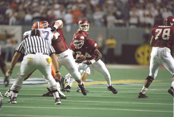 2 Dec 1995:  Running back Madre Hill of the Arkansas Razorbacks looks for an opening during a playoff game against the Florida Gators at the Georgia Dome in Atlanta, Georgia.  Florida won the game 34-3. Mandatory Credit: Matthew Stockman  /Allsport