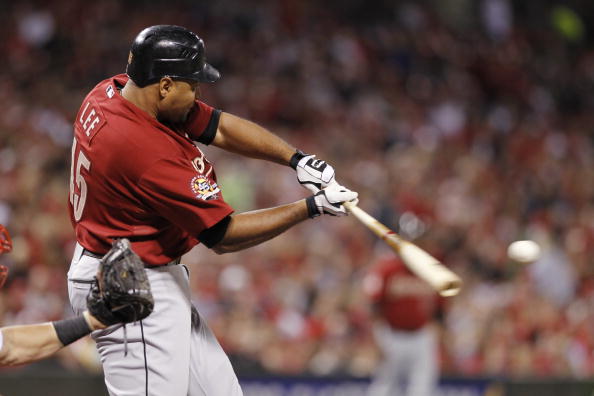 CINCINNATI, OH - SEPTEMBER 28: Carlos Lee #45 of the Houston Astros hits a ball that would have been a home run but was caught above the outfield wall by Drew Stubbs of the Cincinnati Reds at Great American Ball Park on September 28, 2010 in Cincinnati, O