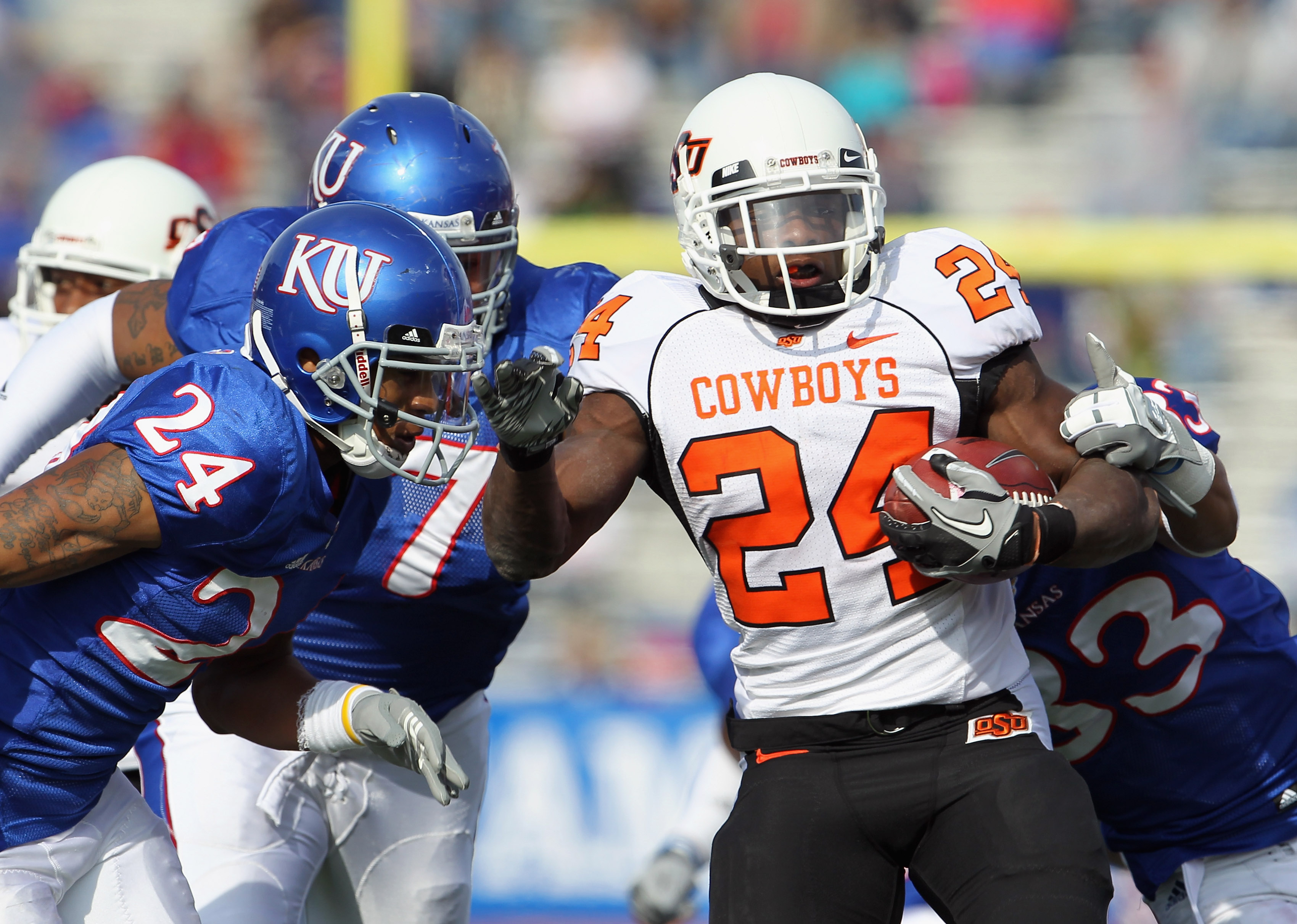 LAWRENCE, KS - NOVEMBER 20:  Running back Kendall Hunter #24 of the Oklahoma State Cowboys carries the ball during the game against the Kansas Jayhawks on November 20, 2010 at Memorial Stadium in Lawrence, Kansas.  (Photo by Jamie Squire/Getty Images)